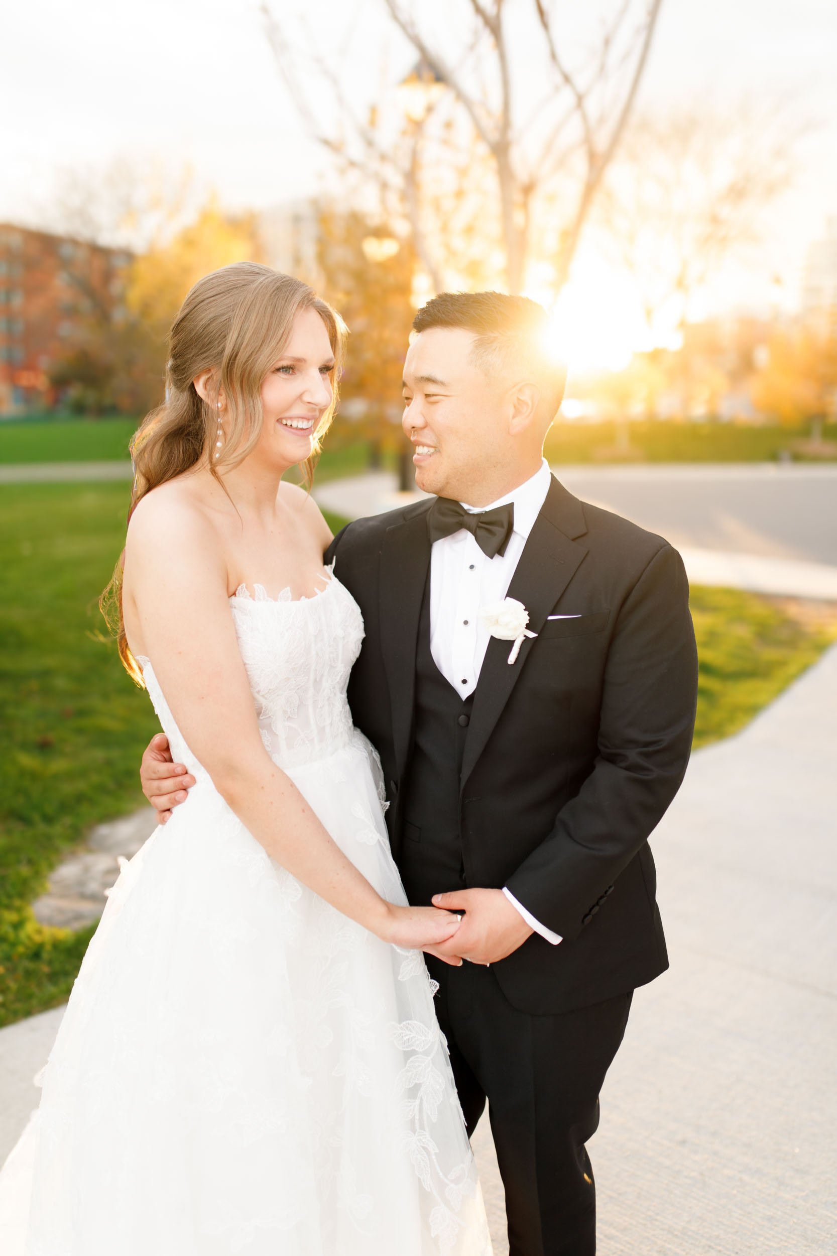 Bride and groom posing outdoors near the Pearle Hotel in Burlington Ontario