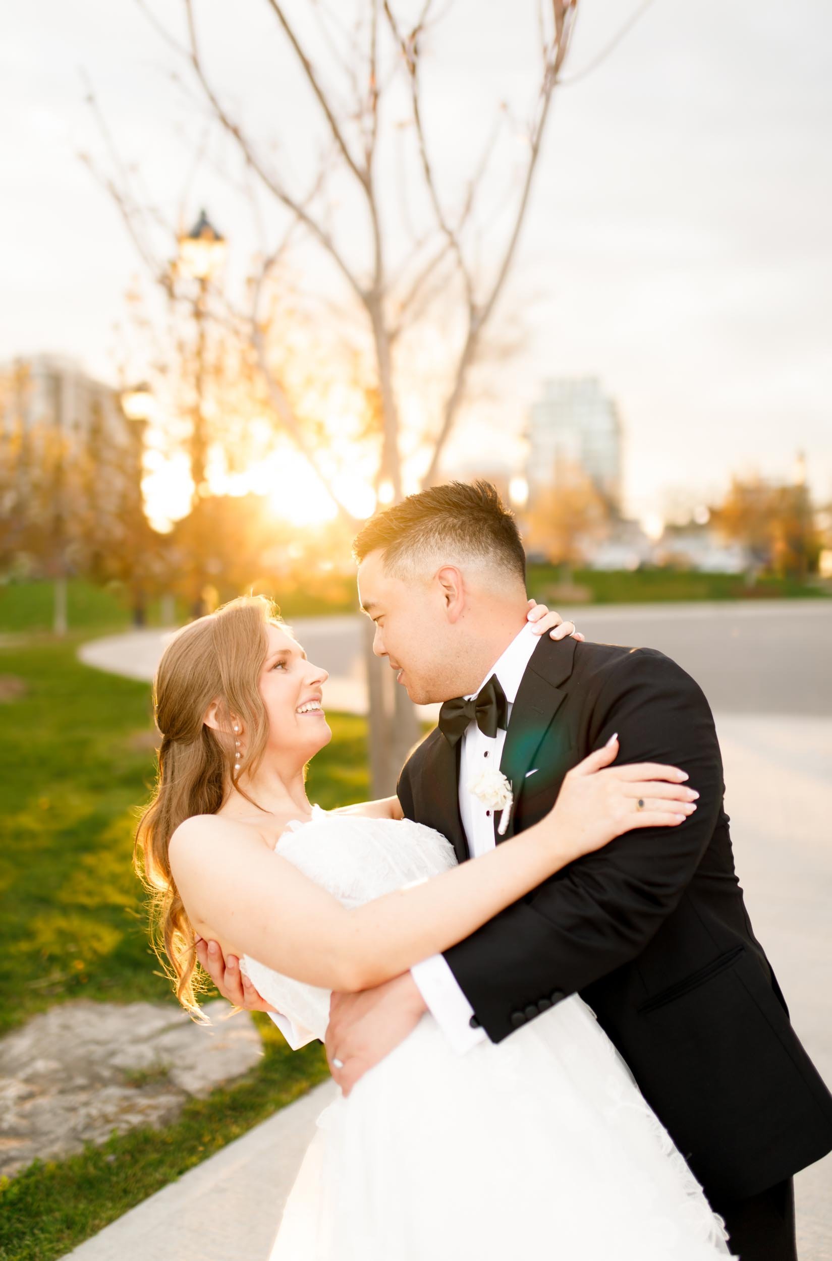 Bride and groom laughing together during sunset in Burlington Ontario