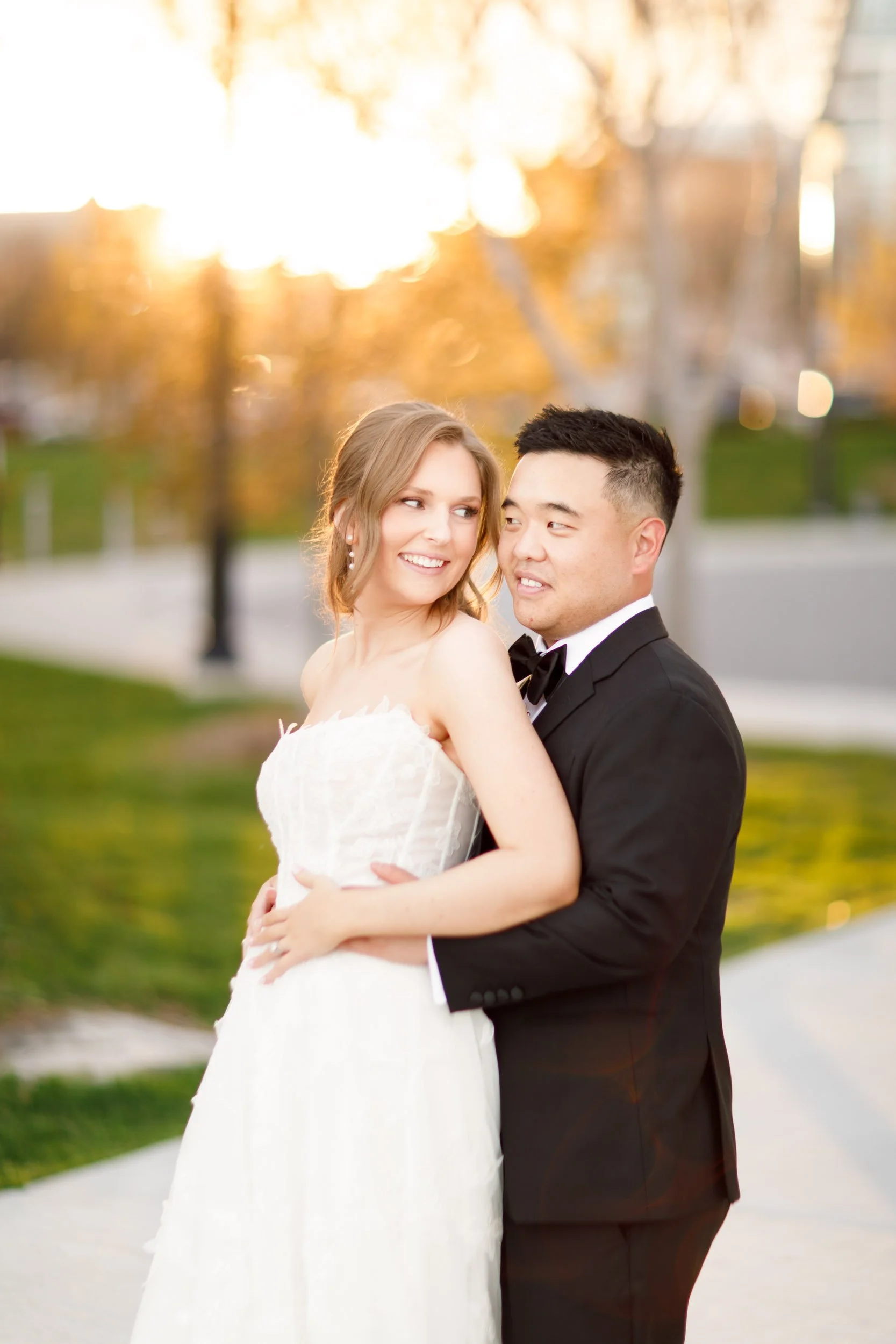 Bride and groom sharing a romantic sunset moment near the Pearle Hotel in Burlington Ontario
