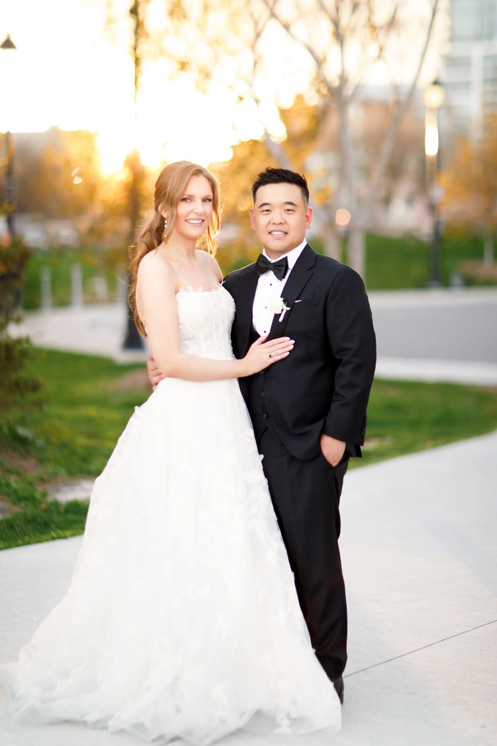 Bride and groom posing together at sunset near the Pearle Hotel in Burlington Ontario