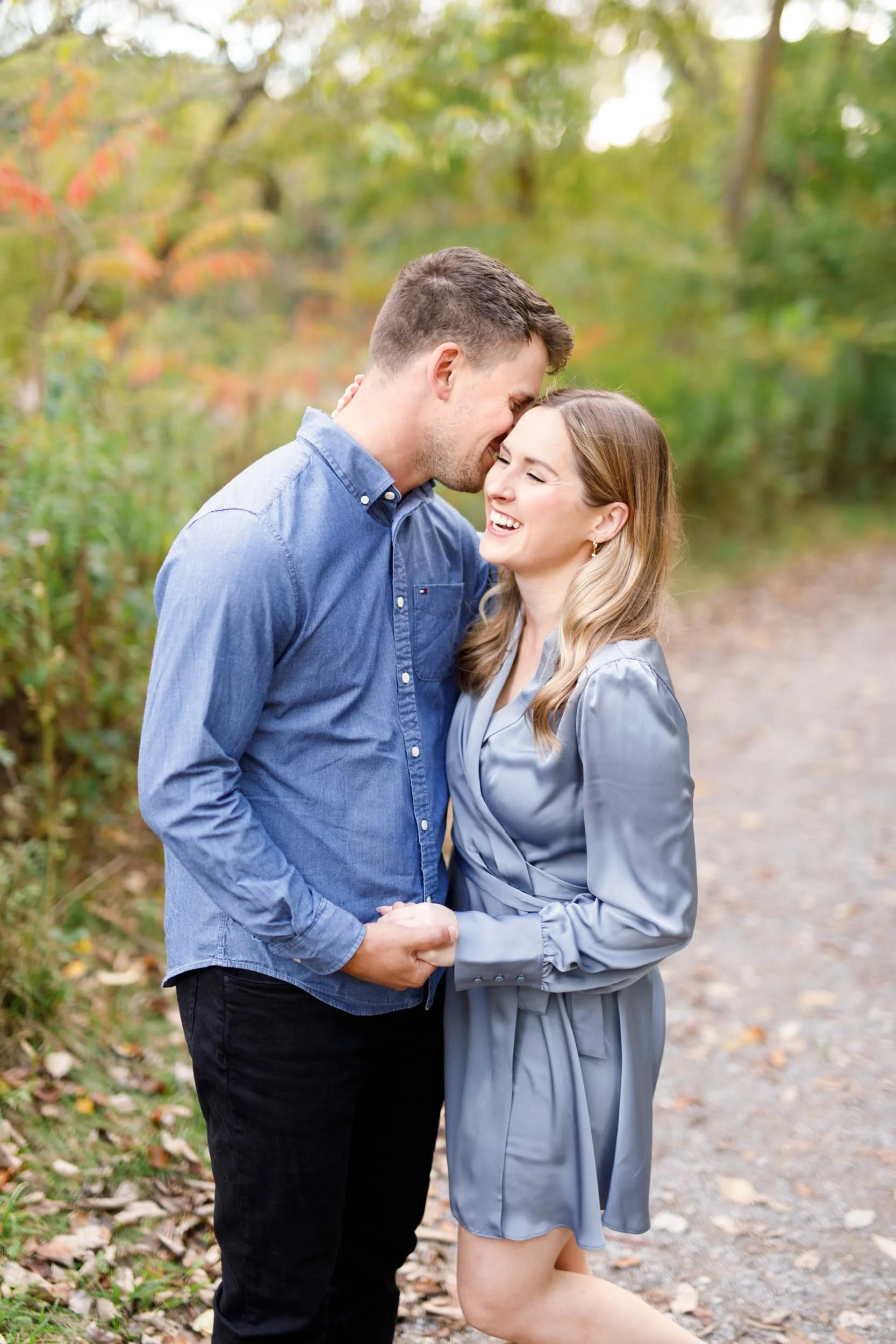 Close up engagement portrait of a couple sharing a quiet moment at Grindstone Marsh Trail in Burlington Ontario