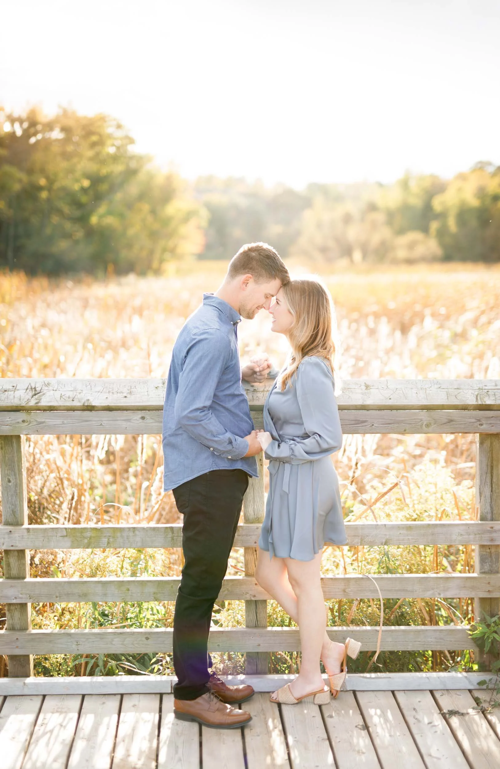 Couple sharing a quiet moment during an engagement session at Grindstone Marsh Trail in Burlington Ontario
