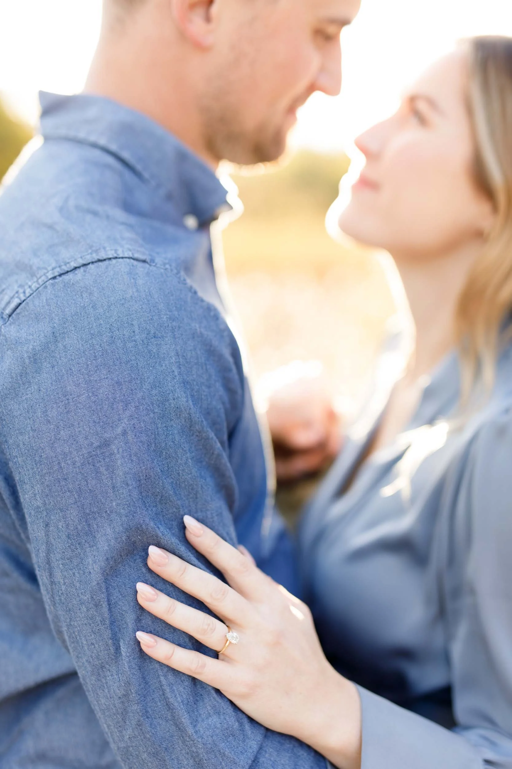 Close up engagement portrait of a couple standing together at Grindstone Marsh Trail in Burlington Ontario