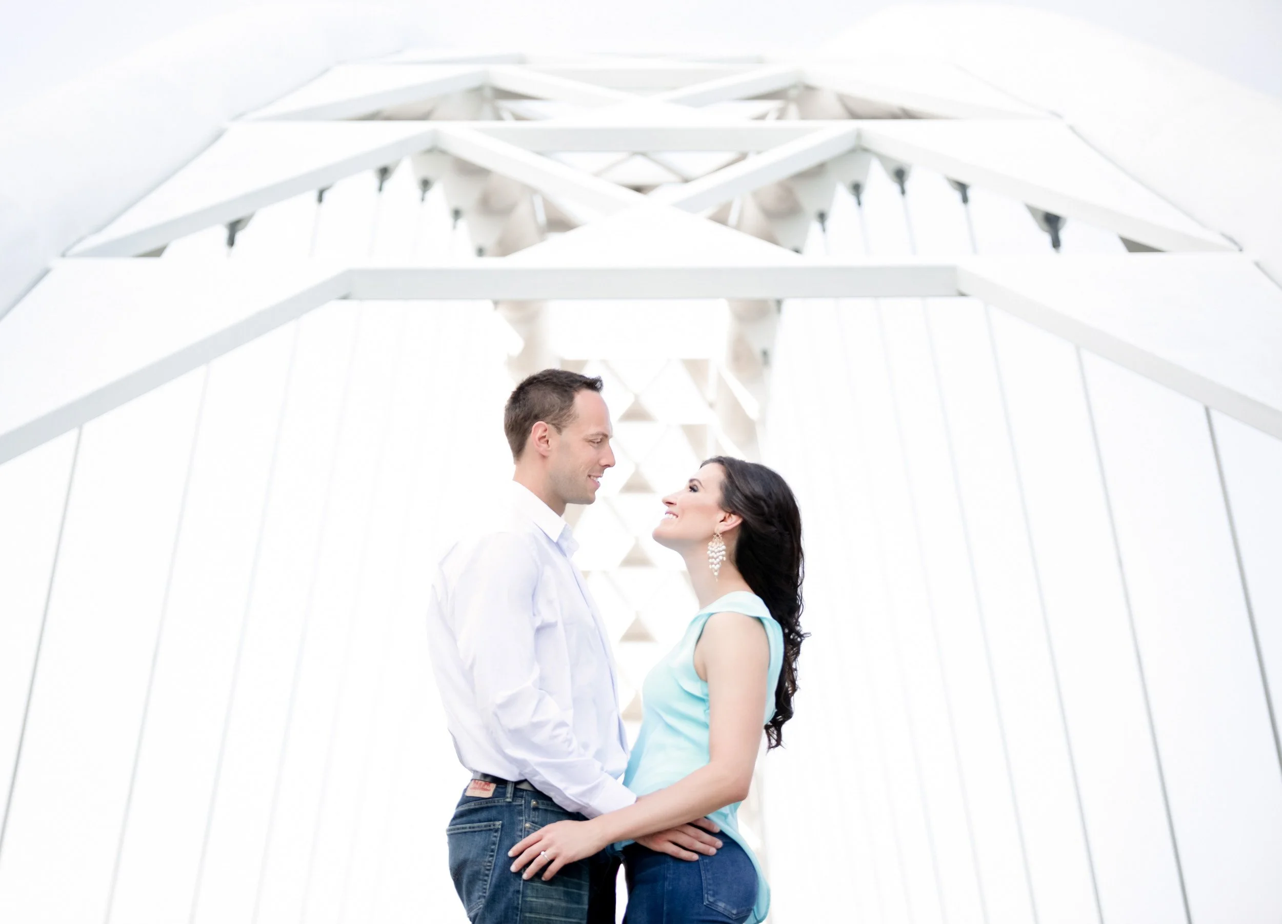 Couple sharing a quiet moment beneath the Humber Bridge during a Toronto wedding photography session (Copy)