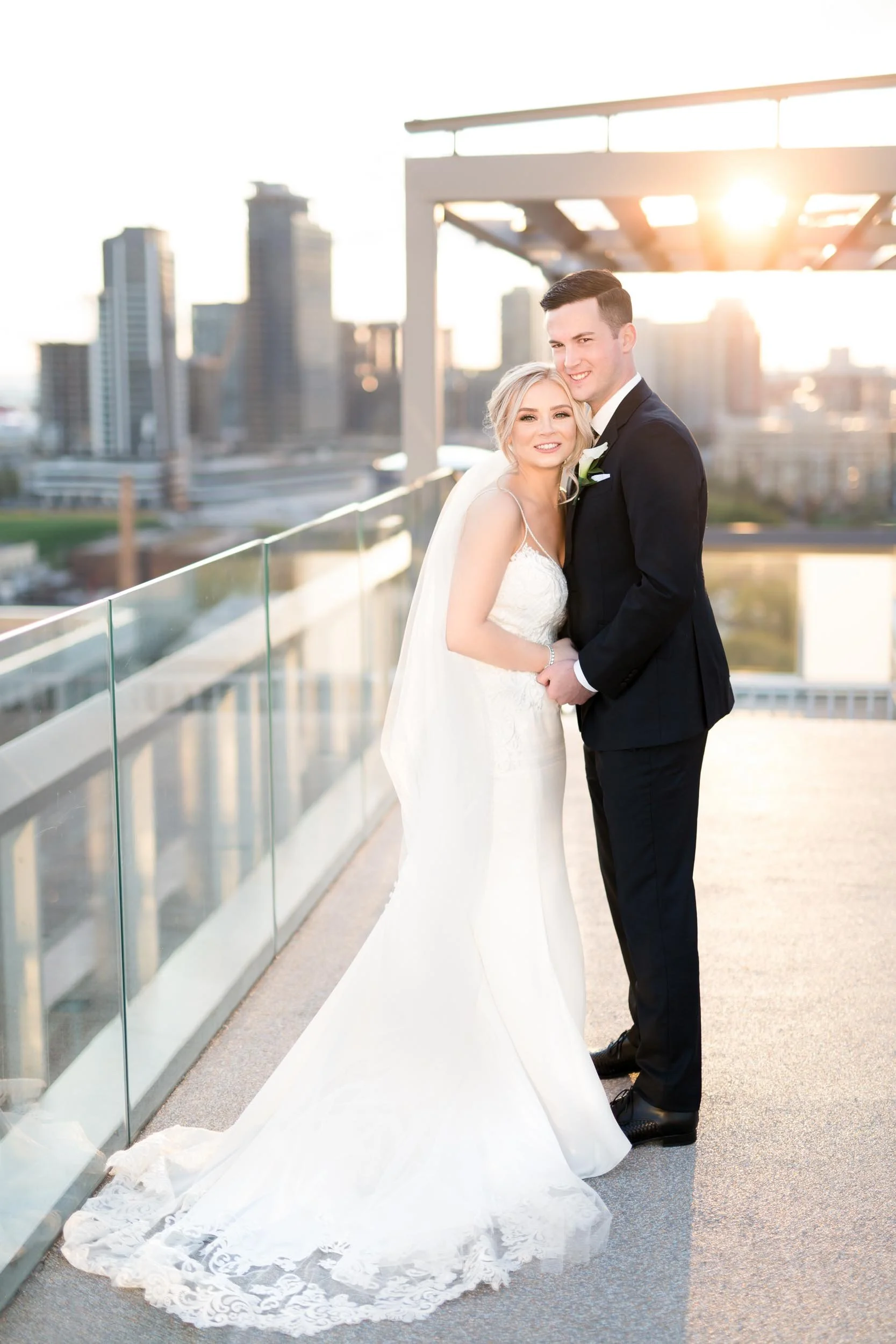 Bride and groom standing together on the rooftop of One Hotel Toronto at golden hour (Copy)