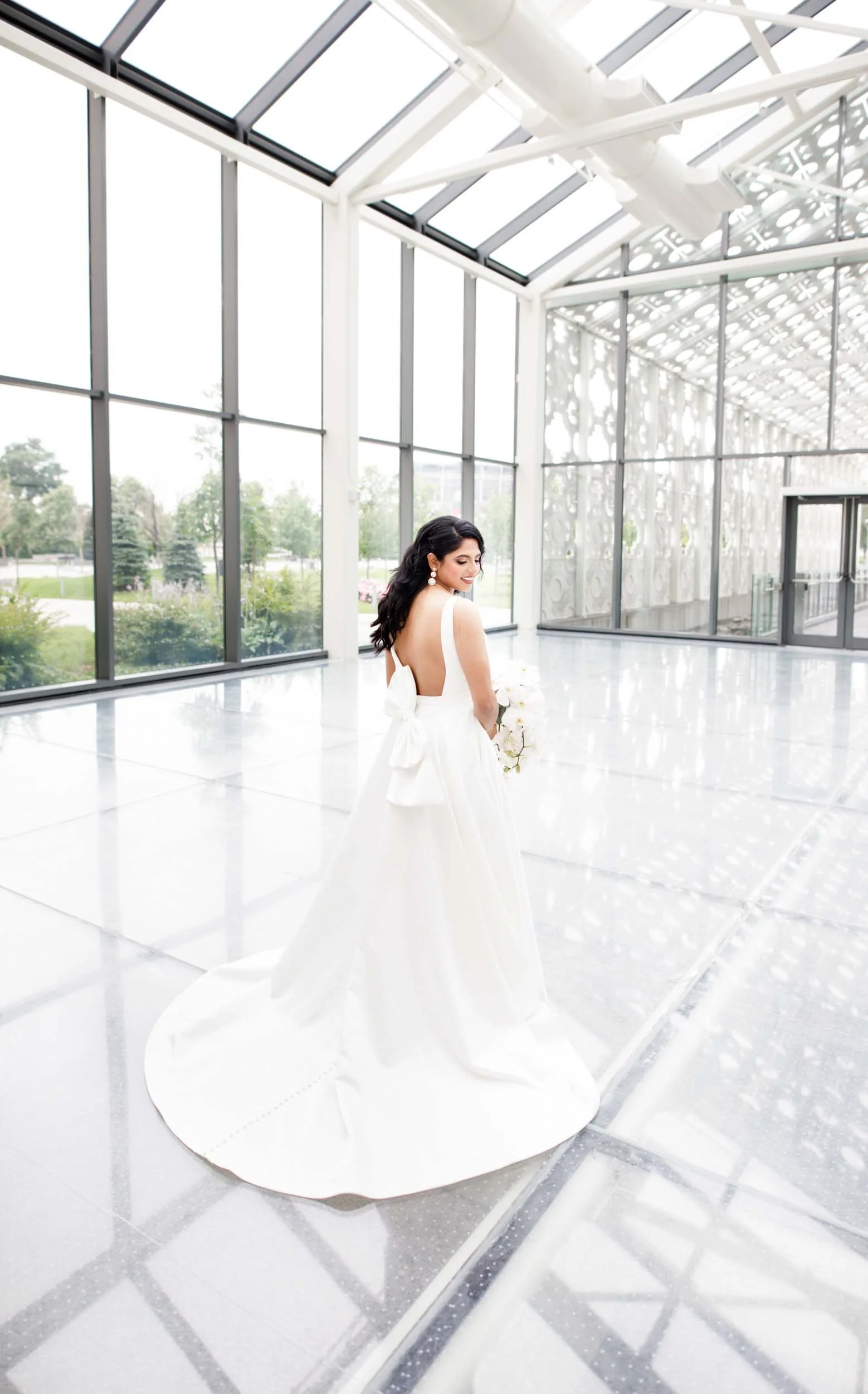 Bride in a bright glass atrium at Hotel X Toronto, photographed in the New Fort Hall area (Copy)