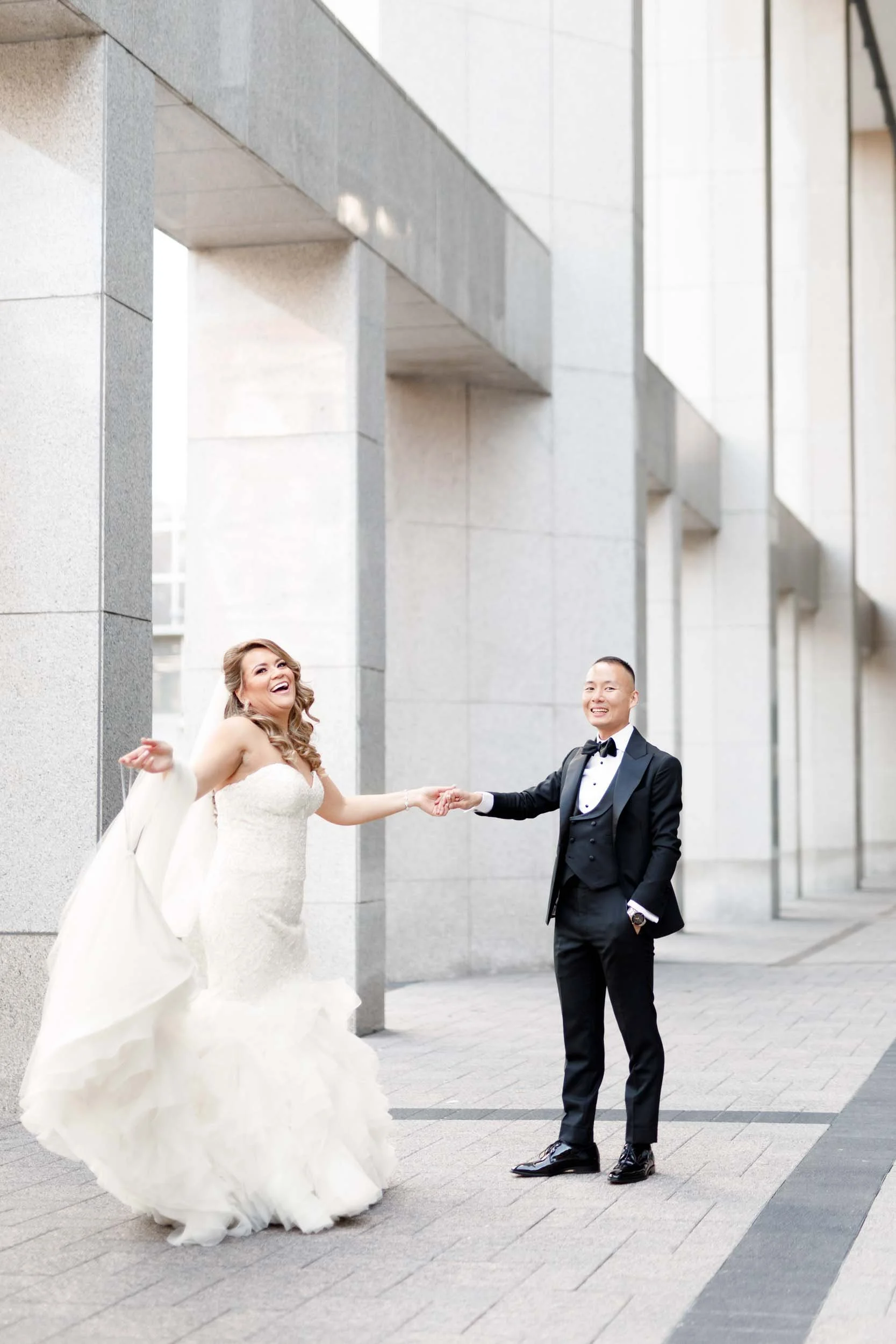Bride and groom portrait in downtown Toronto financial district beside Omni King Edward Hotel