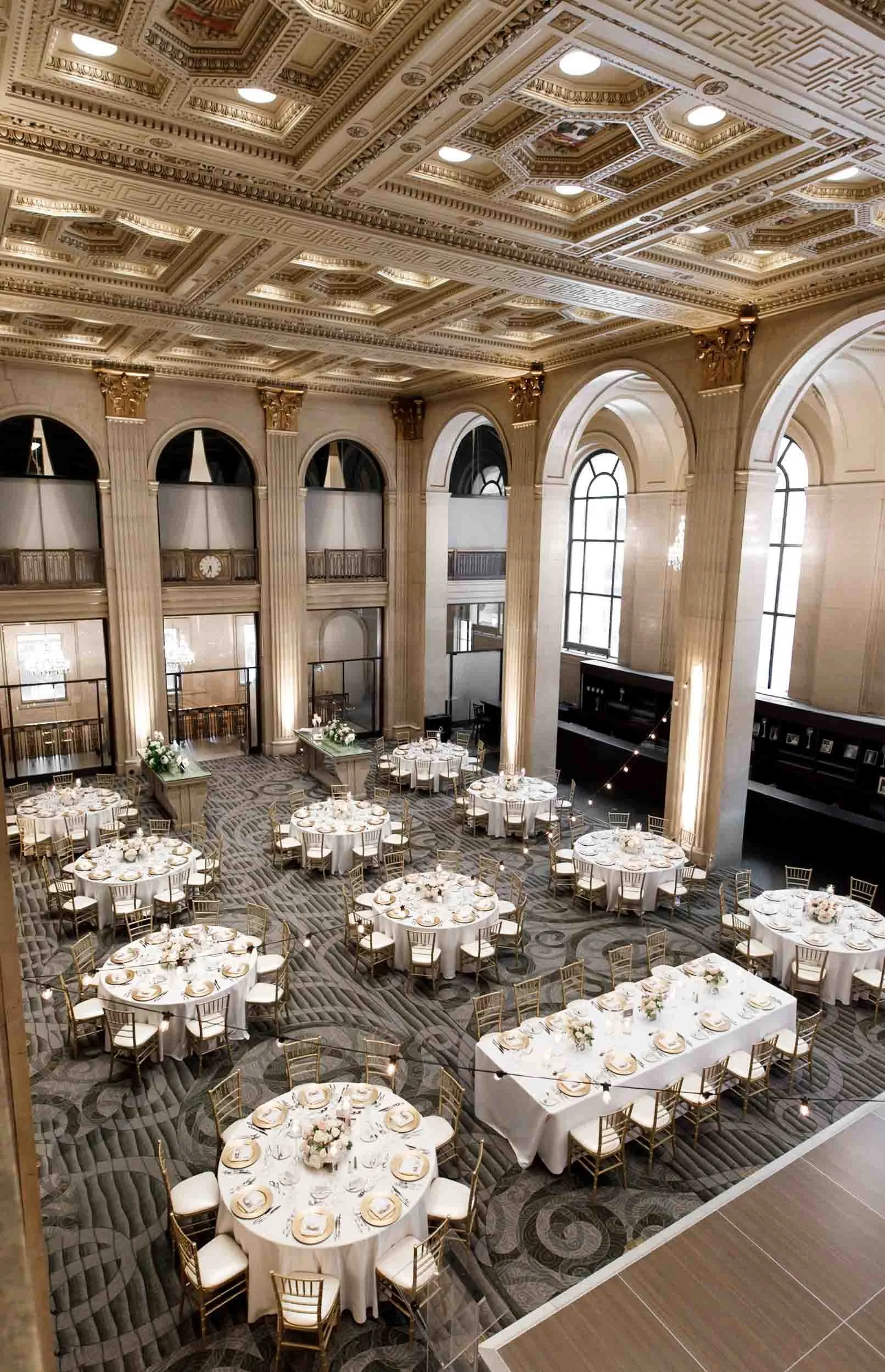 Luxurious wedding reception room aerial view with high ceilings and arched windows at One King West (Copy)