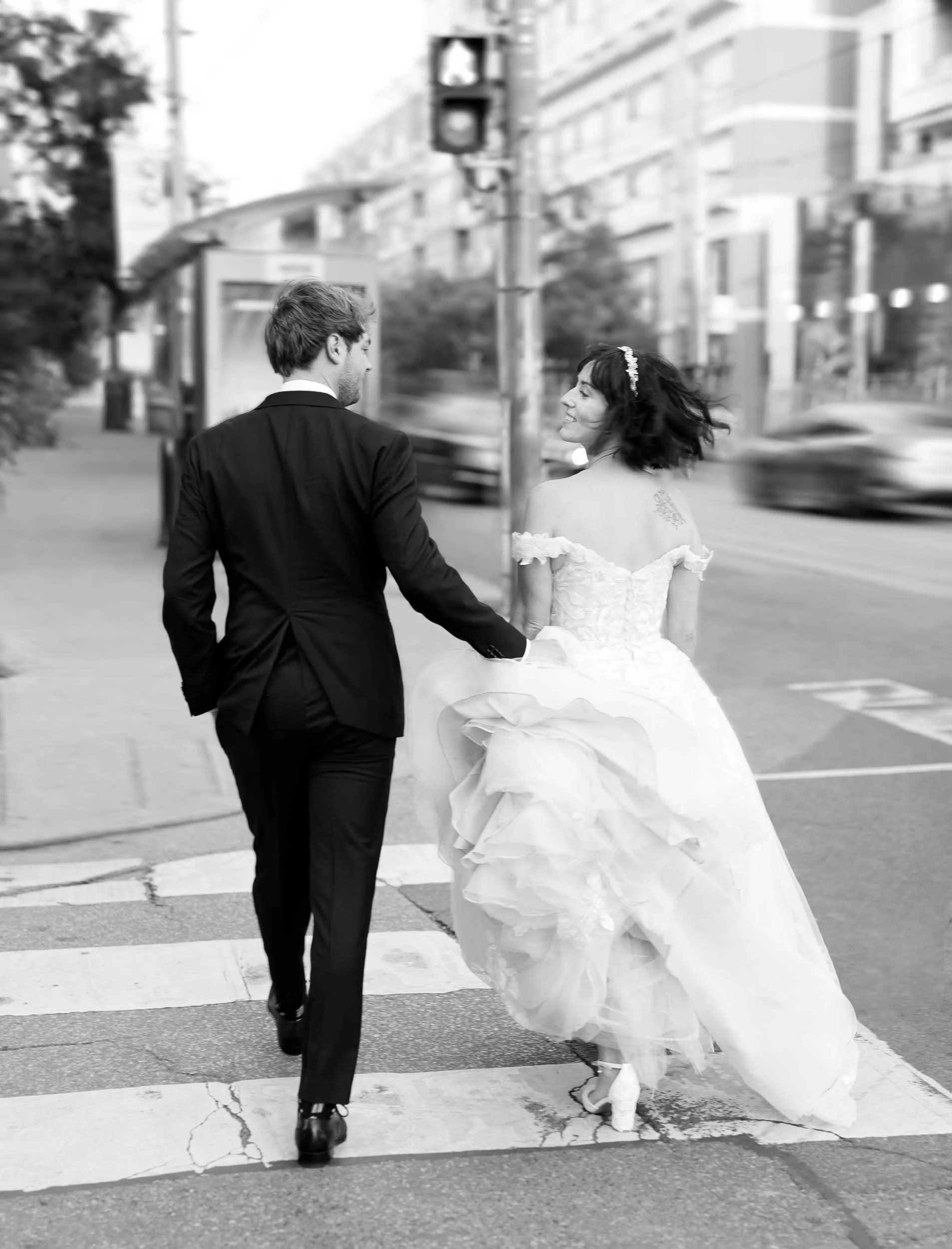 Black and white bride and groom walking together near the Gladstone Hotel in Toronto (Copy)