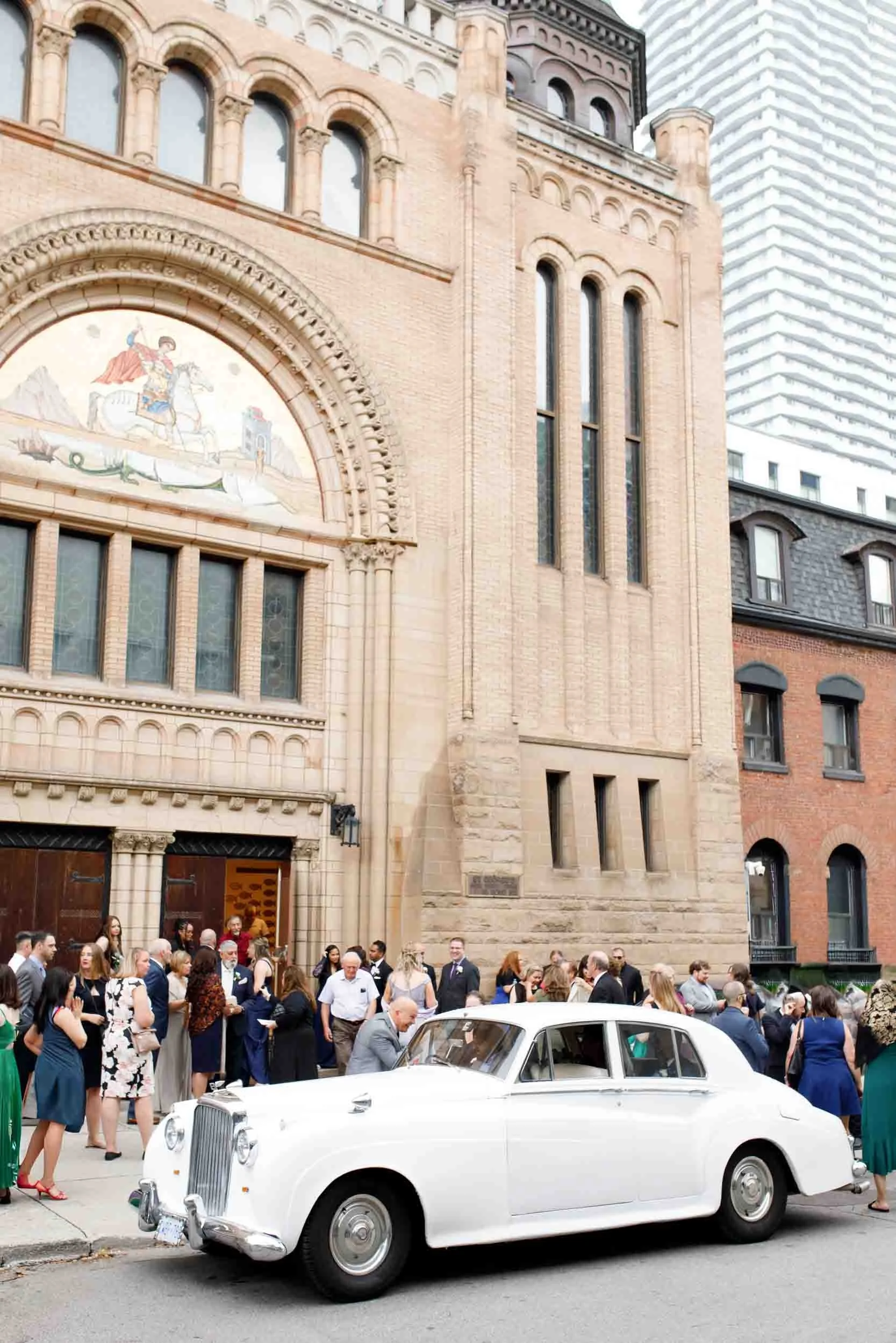 Wedding guests gathered outside St. George’s Greek Orthodox Church with a classic Rolls-Royce (Copy)
