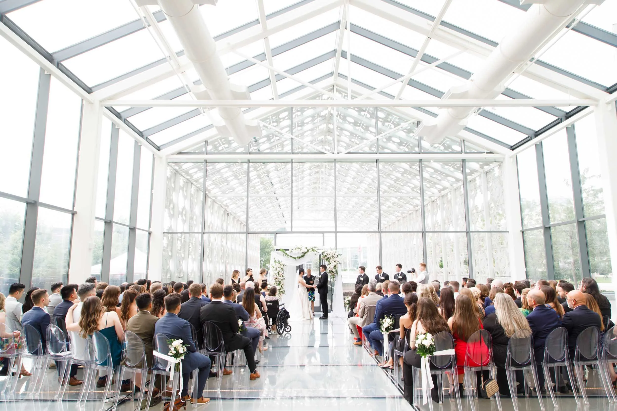 Wide angle wedding ceremony inside Hotel X Toronto’s New Fort Hall with clean modern lines and soft light (Copy)