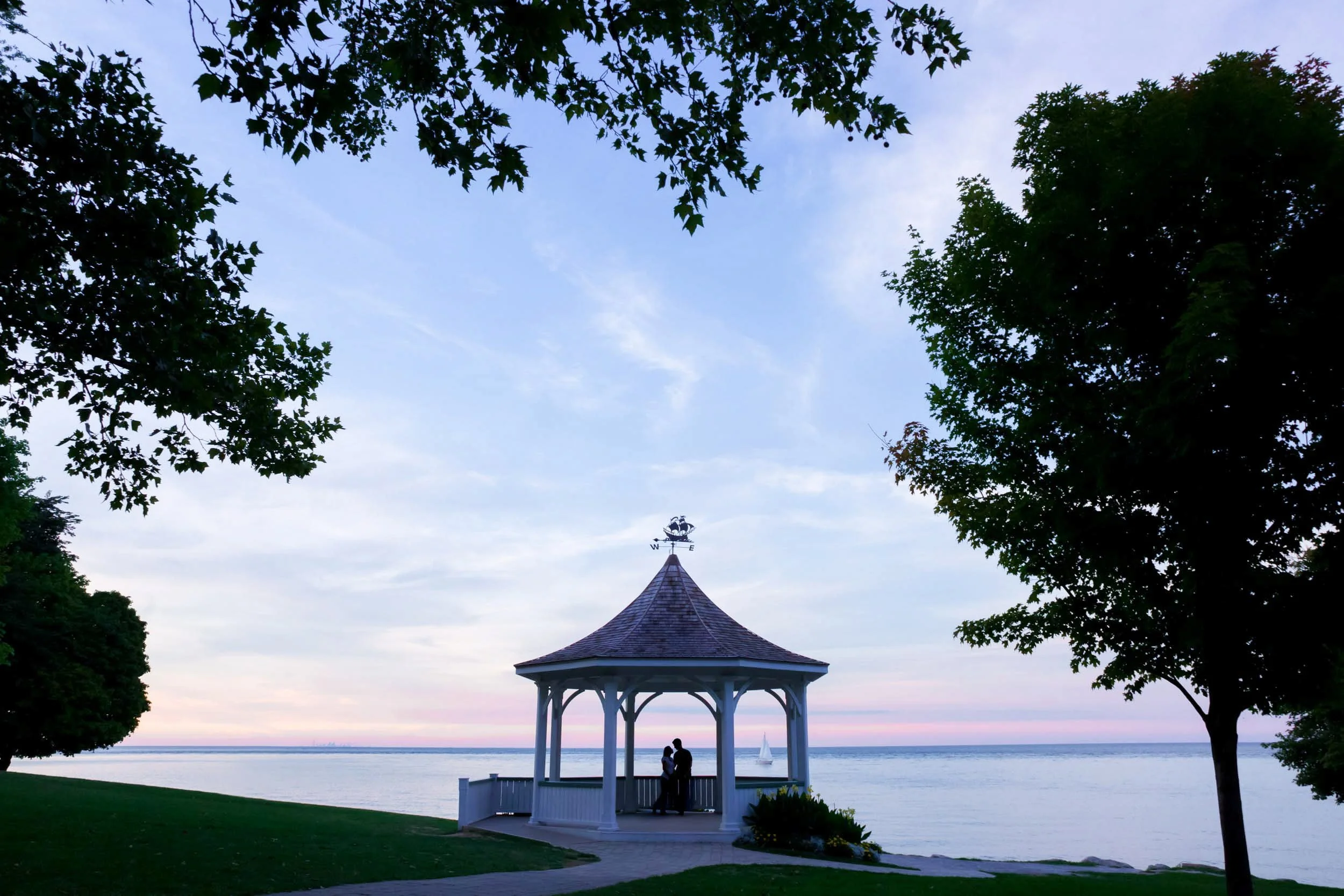 Couple silhouetted at dusk in the lakeside gazebo engagement shoot in Niagara-on-the-Lake (Copy)