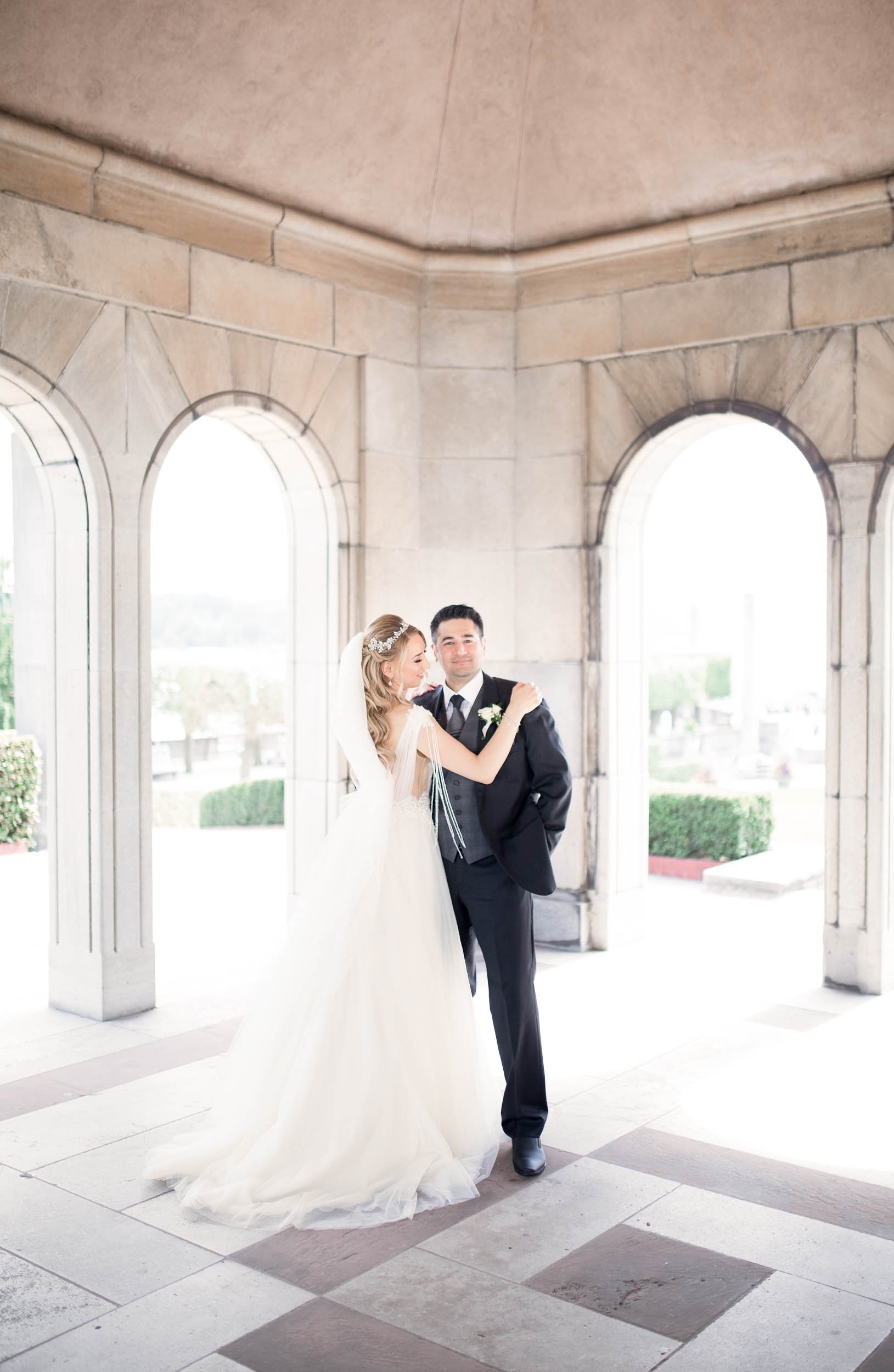 Bride and groom portrait beneath the pavilion arches at Oakes Garden Theatre wedding (Copy)