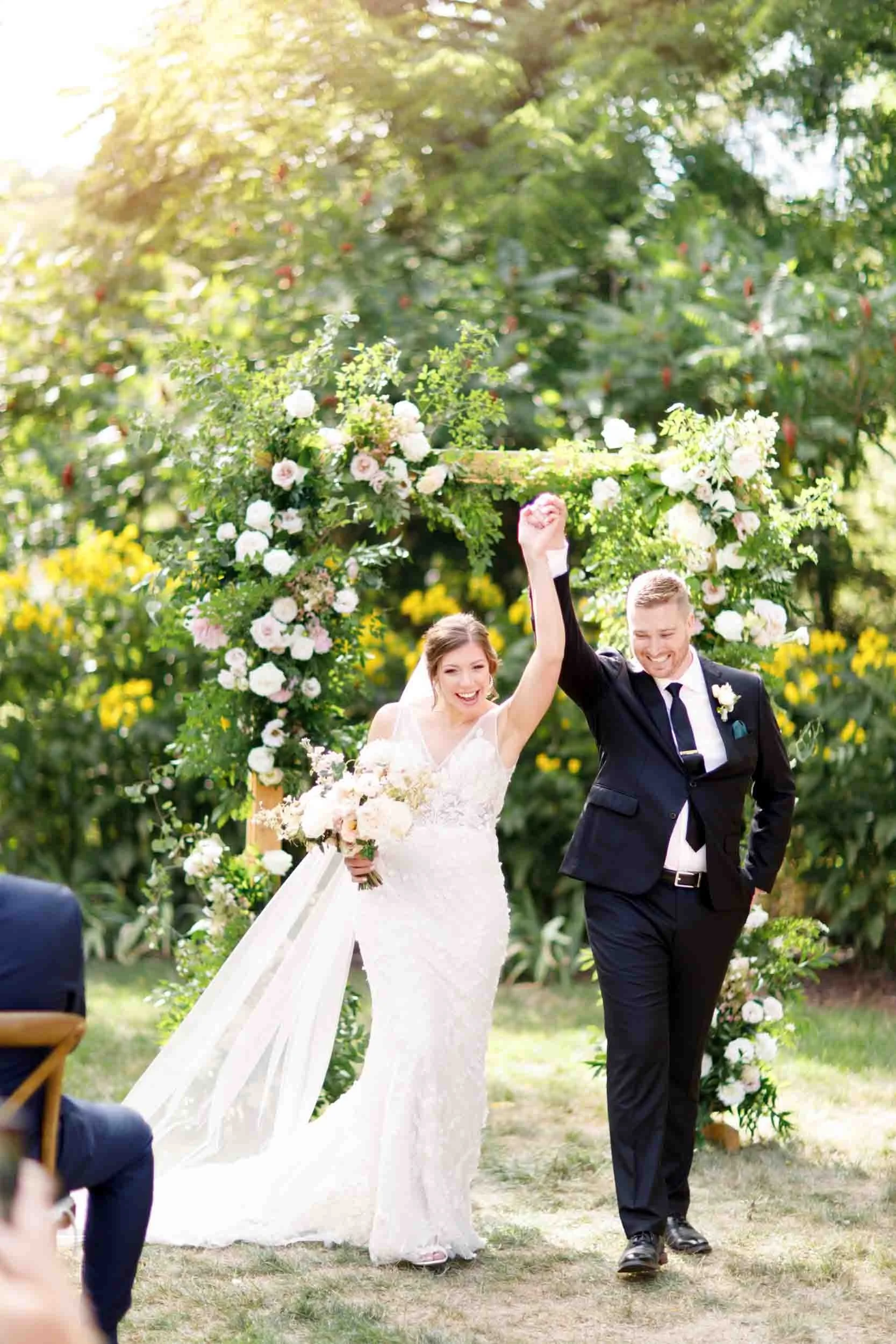 Bride and groom celebrating their ceremony recessional at a Beamsville wedding (Copy)