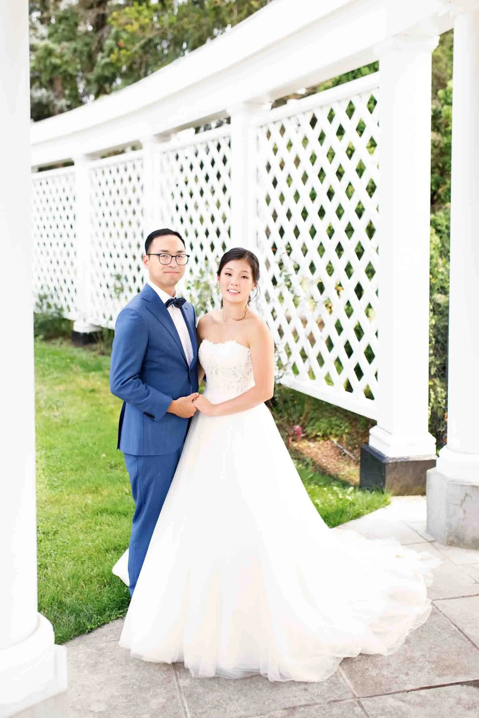 Bride and groom portrait beside white lattice at Royal Botanical Gardens wedding (Copy)
