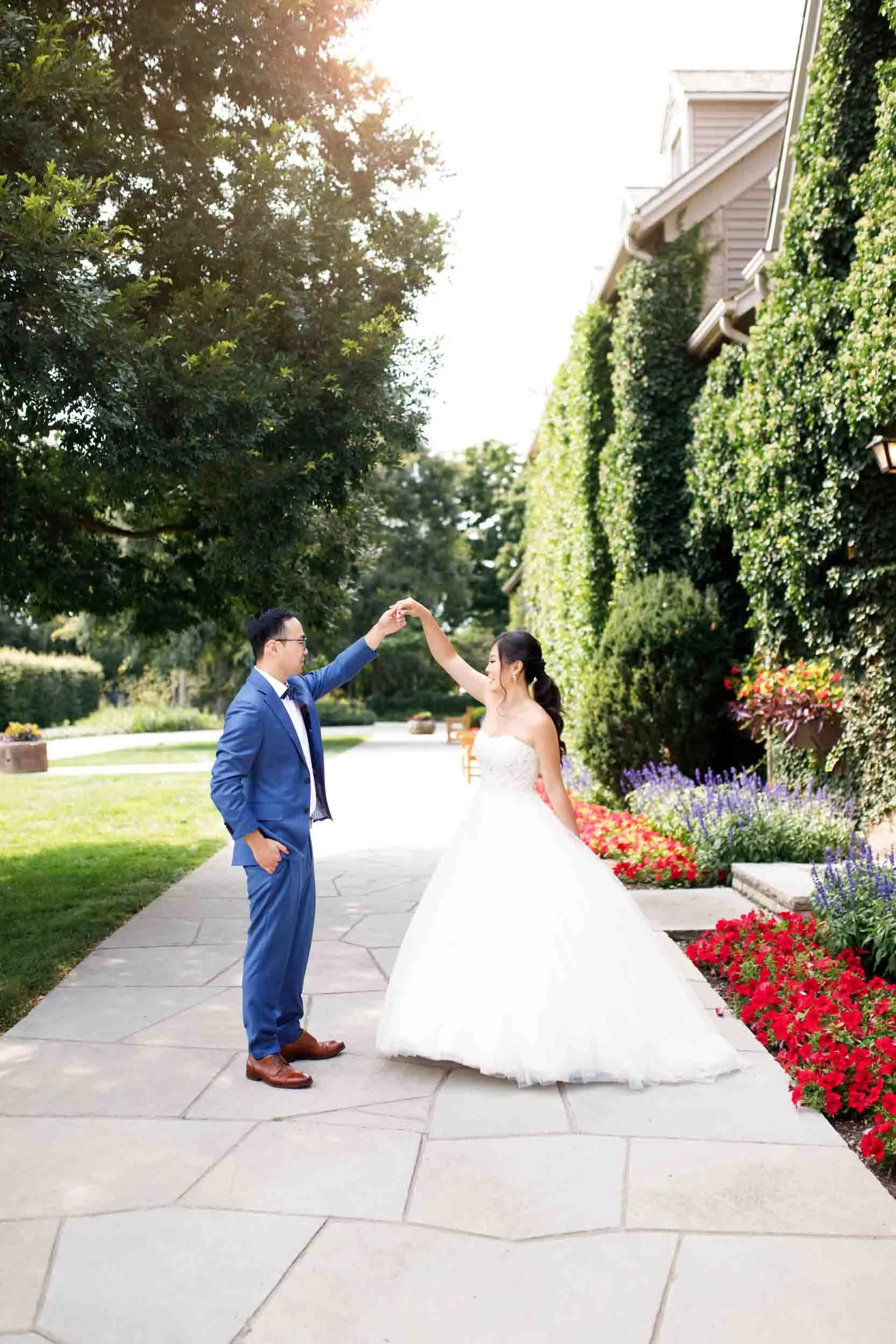Bride twirling under garden arches at Royal Botanical Gardens in Niagara Falls (Copy)