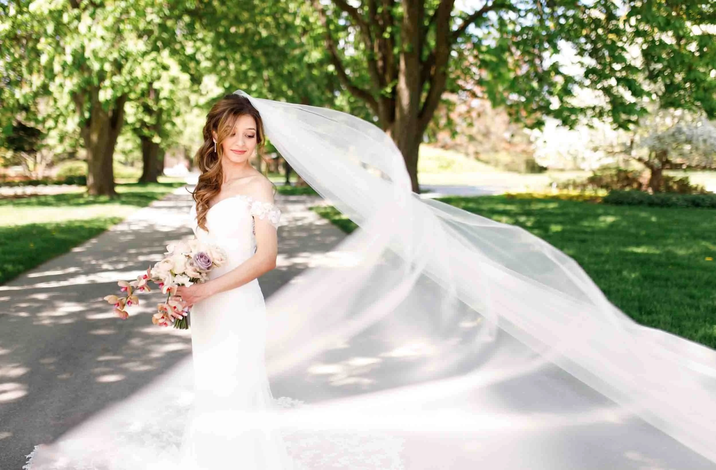 Bride with flowing veil in the gardens at Queenston Heights Park in Niagara-on-the-Lake (Copy)