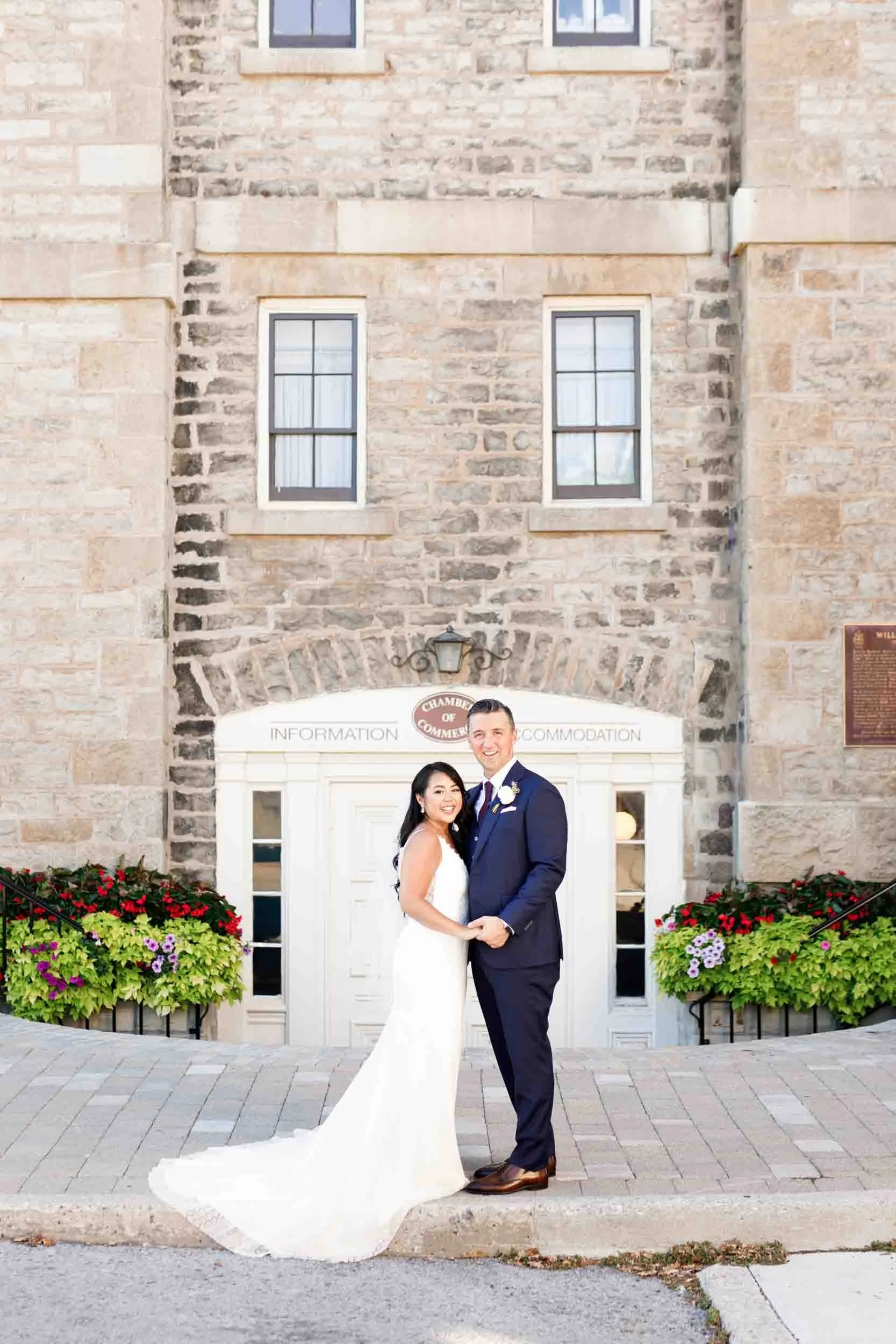 Bride and groom posing outside the Old Court House in Niagara-on-the-Lake (Copy)