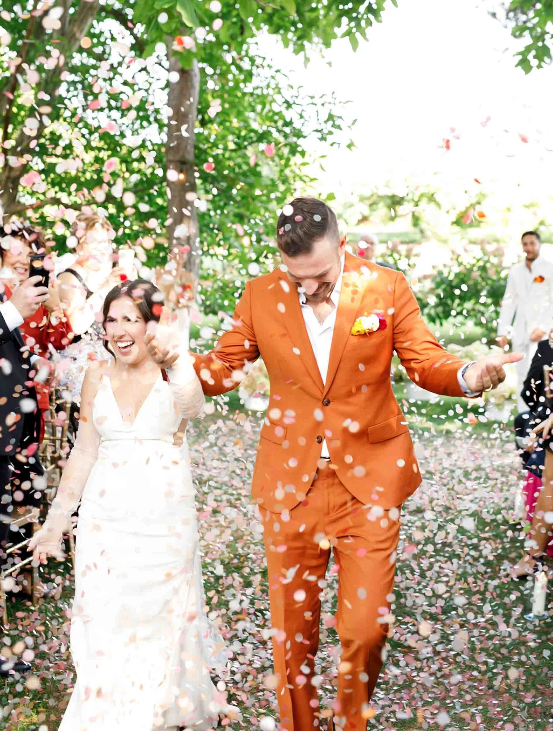 Bride and groom celebrating with confetti at Cherry Avenue Farms wedding (Copy)