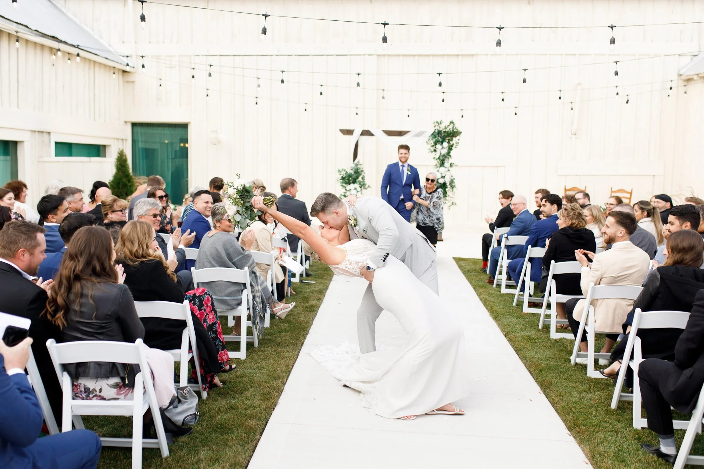 Romantic dip and kiss walking down aisle after Sorella Farms wedding ceremony (Copy)
