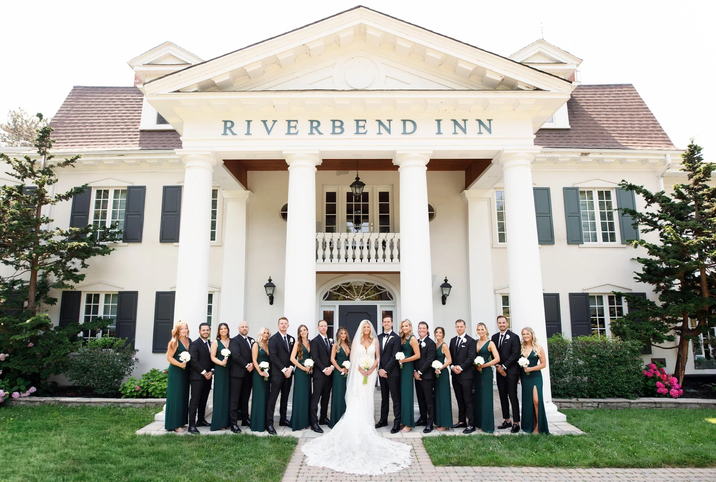 Wedding party gathered outside Riverbend Inn in Niagara-on-the-Lake (Copy)