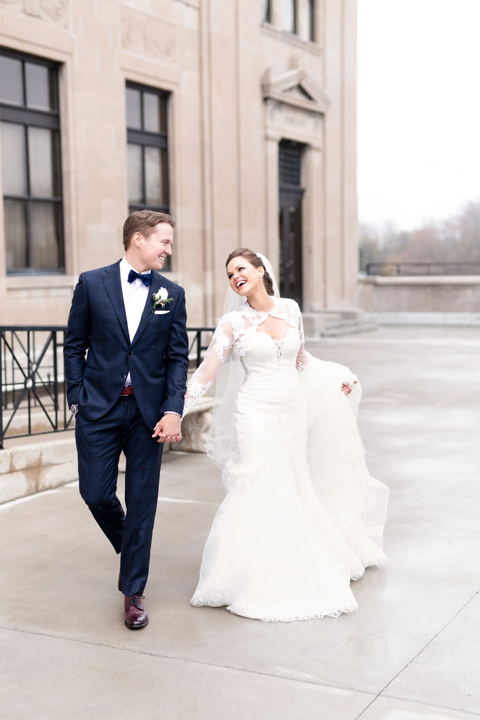 Bride and groom walking together outside LIUNA Station in downtown Hamilton (Copy)