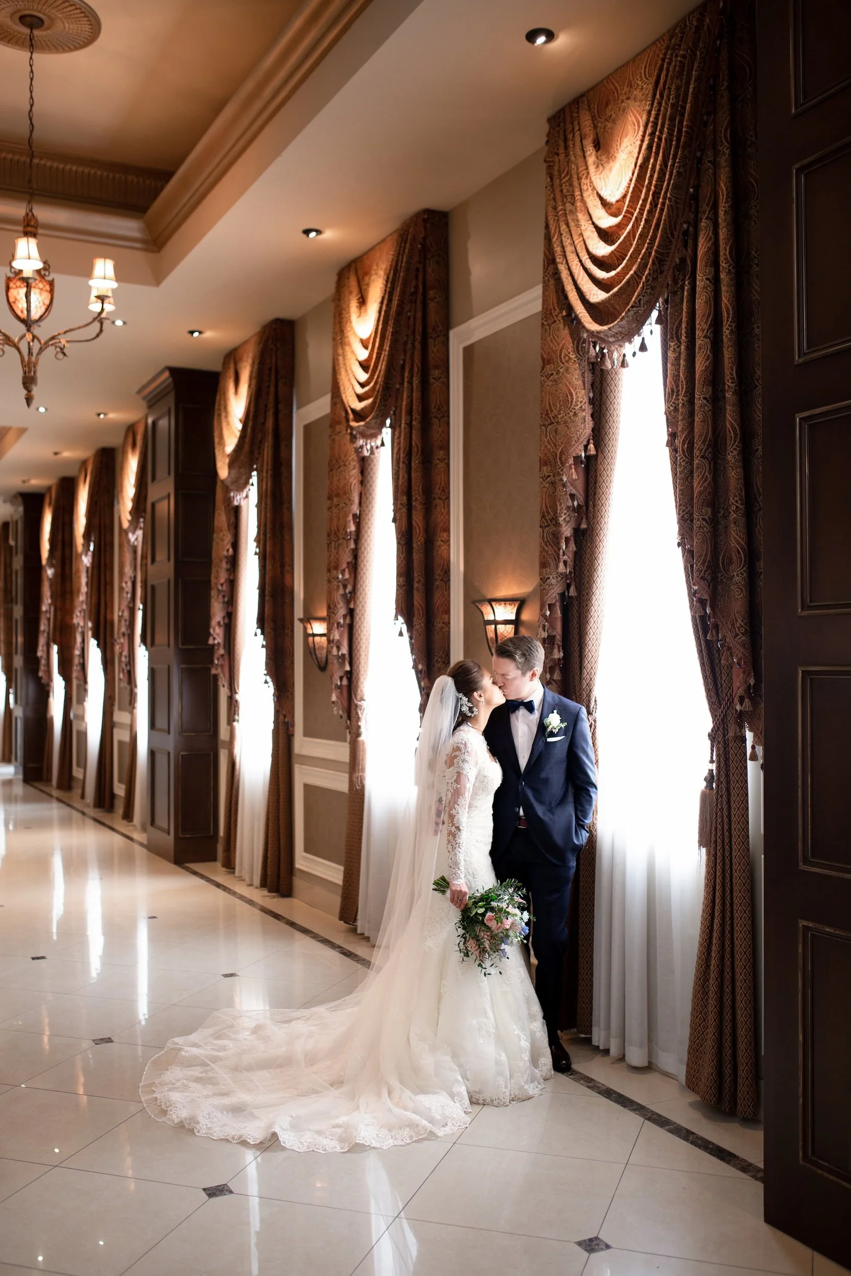 Bride and groom portrait along windowed corridor at LIUNA Station in Hamilton (Copy)