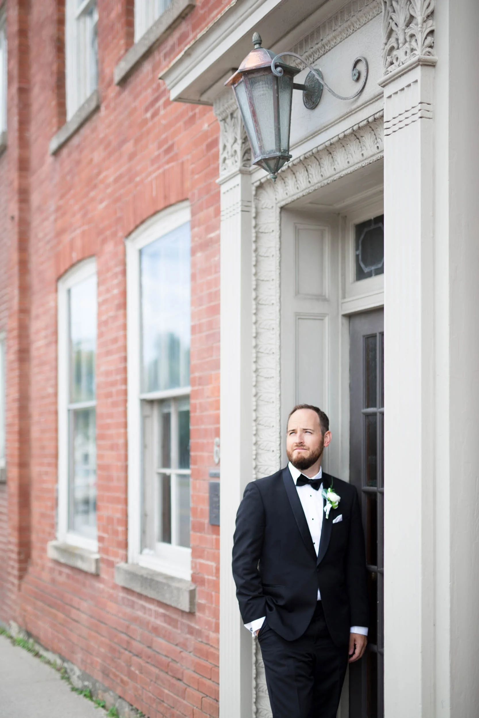 Bride and groom portrait on historic downtown Hamilton street at golden hour (Copy)