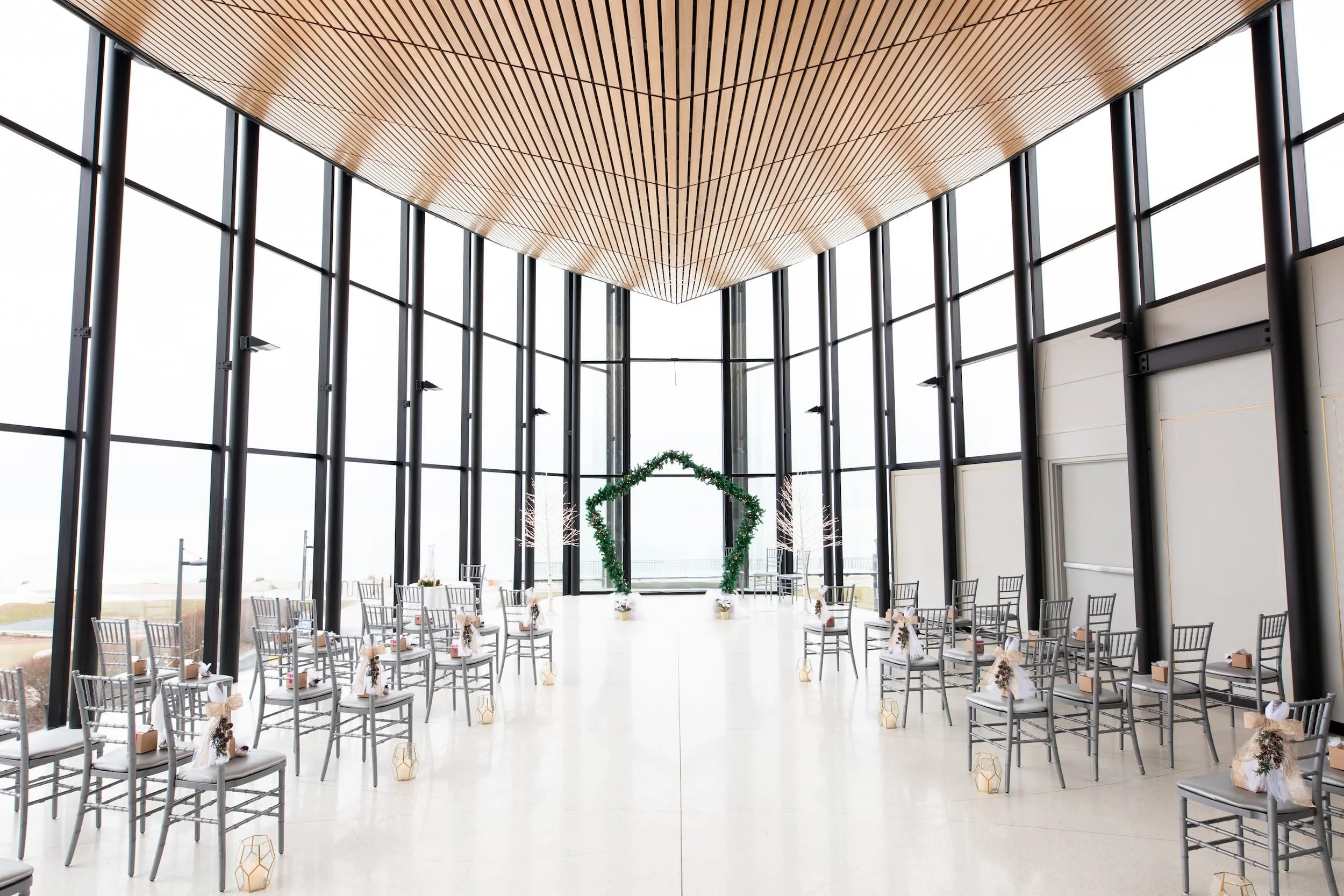 Spencer’s at the Waterfront ceremony space with floor-to-ceiling windows and wood ceiling in Burlington (Copy)