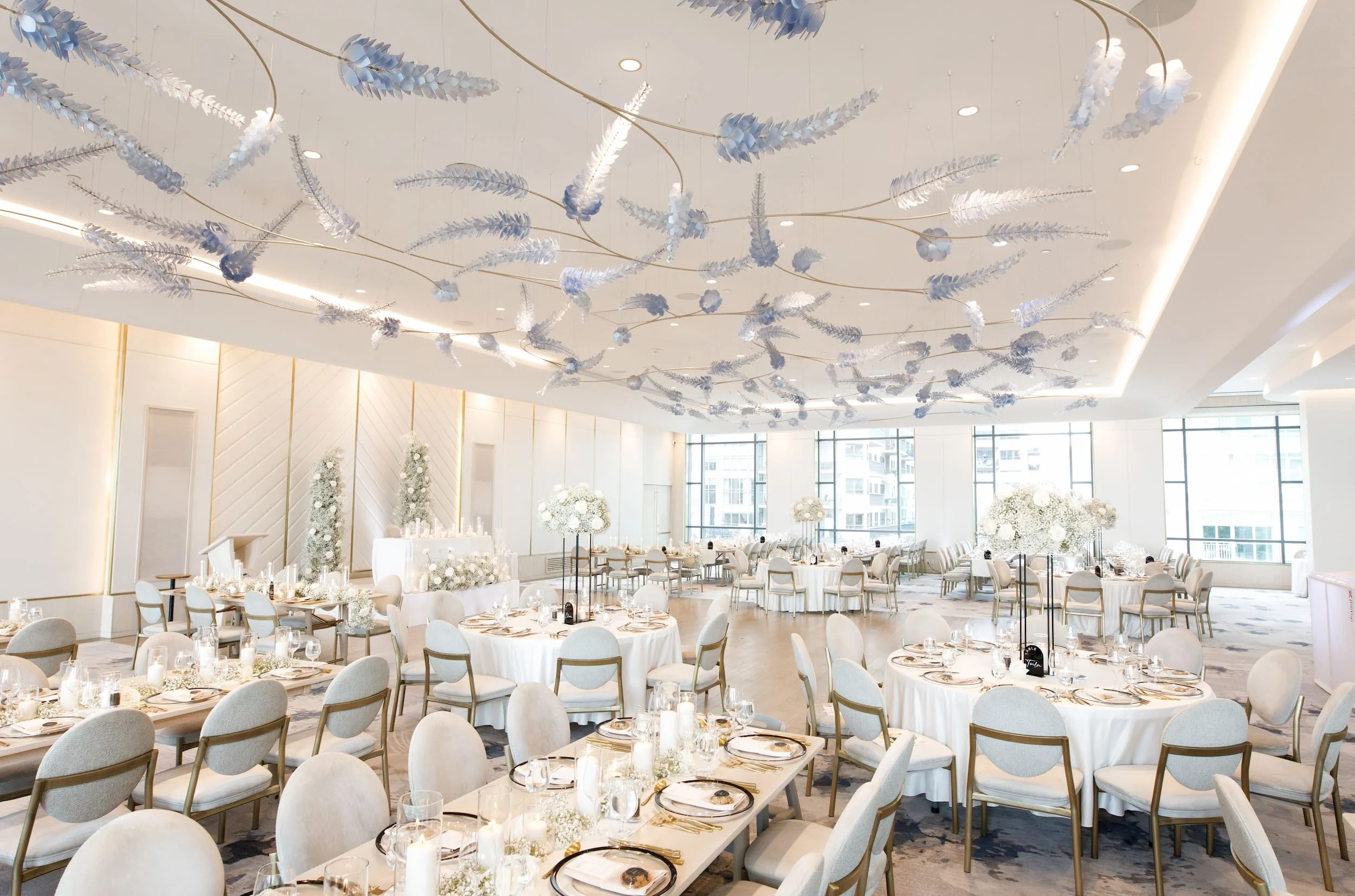 Elegant reception setup with blue ceiling installation at The Pearle Hotel & Spa in Burlington (Copy)