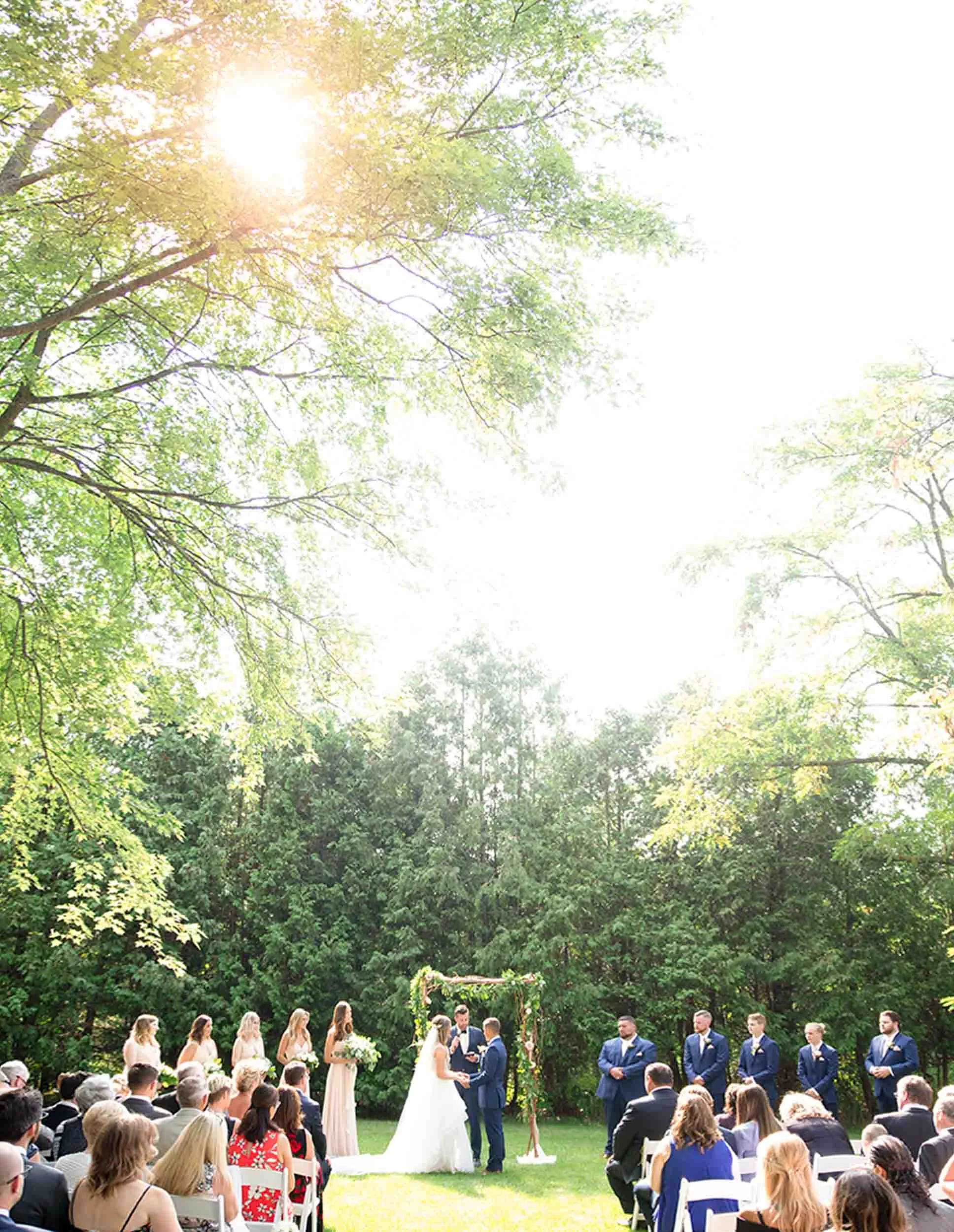 Outdoor wedding ceremony at Roseville Estate Winery with guests seated on the lawn in Cambridge, Ontario (Copy)