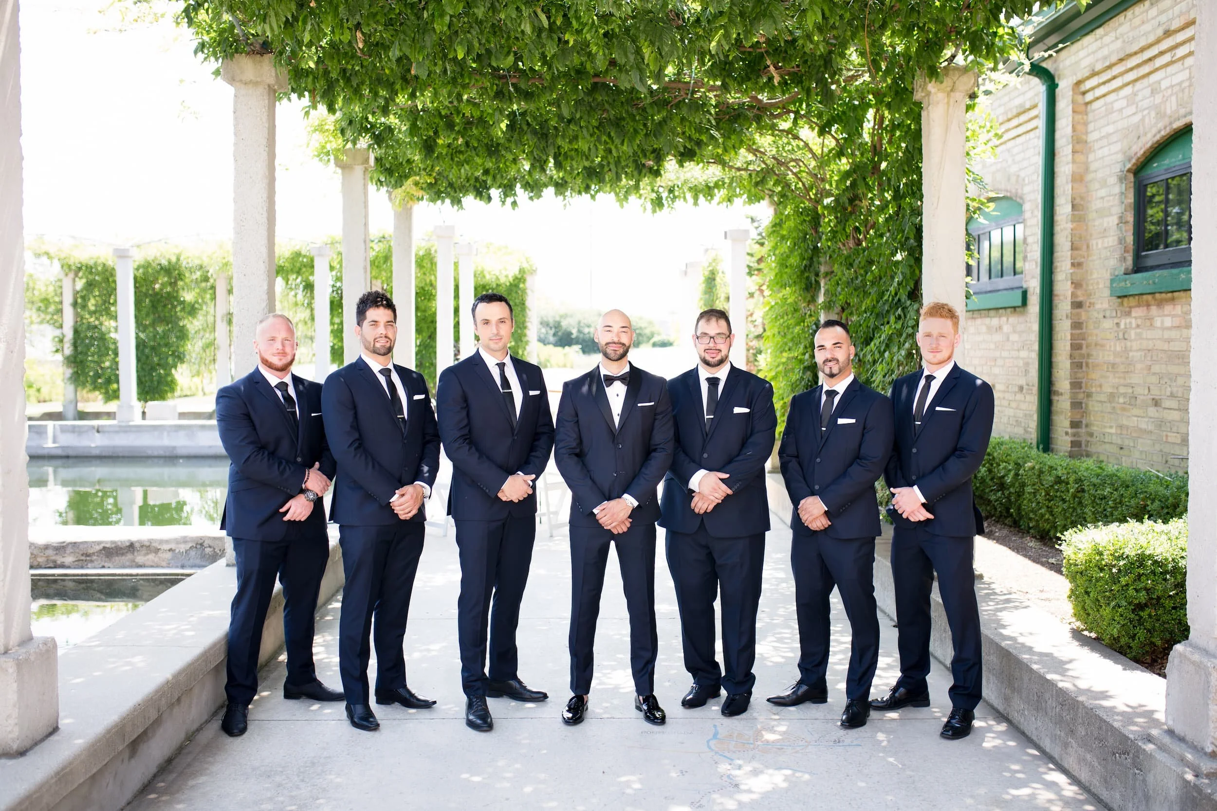 Groomsmen standing together during a wedding at Hacienda Sereda in Cambridge, Ontario (Copy)