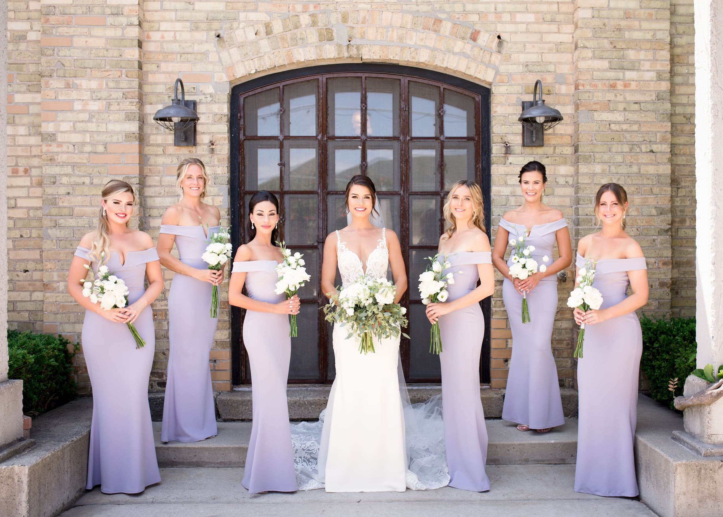 Bridal party standing together during a Cambridge wedding at Hacienda Sereda in the Waterloo Region (Copy)