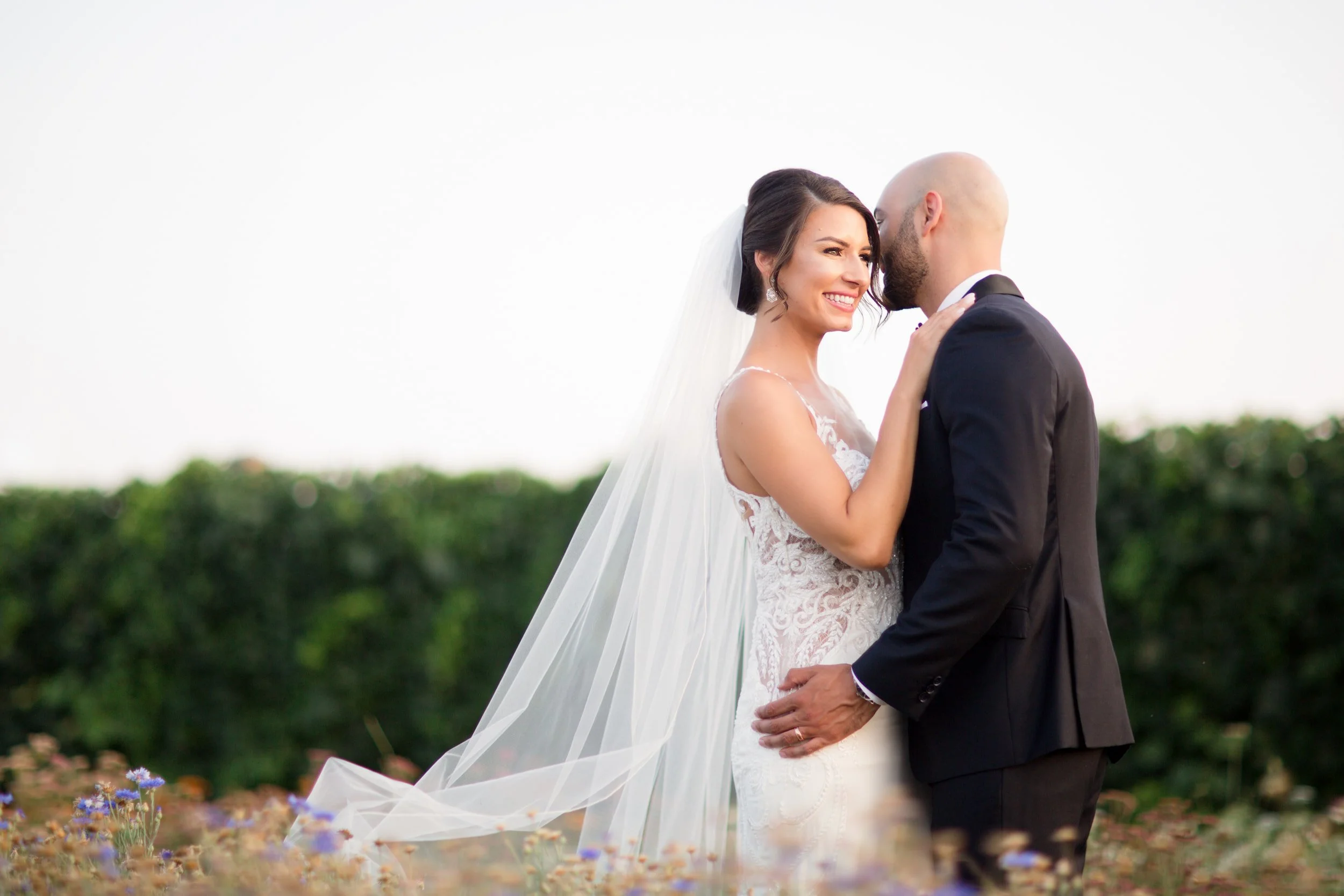Bride and groom embracing outdoors during wedding portraits at Hacienda Sereda in Cambridge, Ontario (Copy)