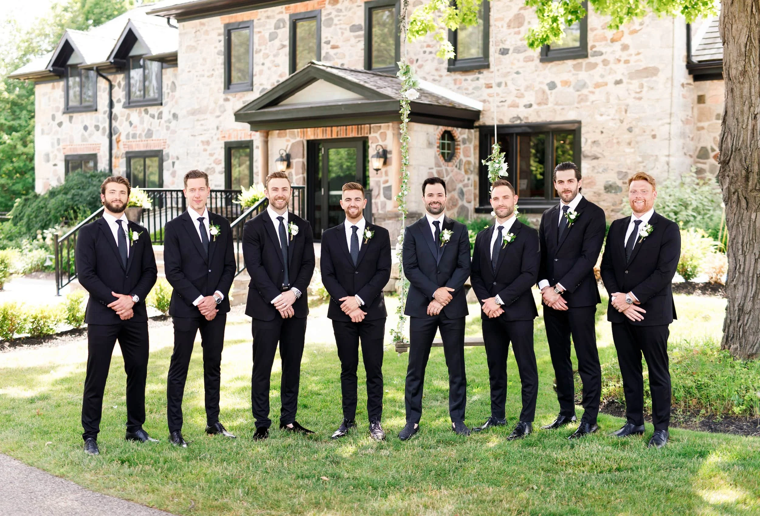 Groomsmen lined up for wedding portraits outside Roseville Estate Winery in Cambridge, Ontario (Copy)