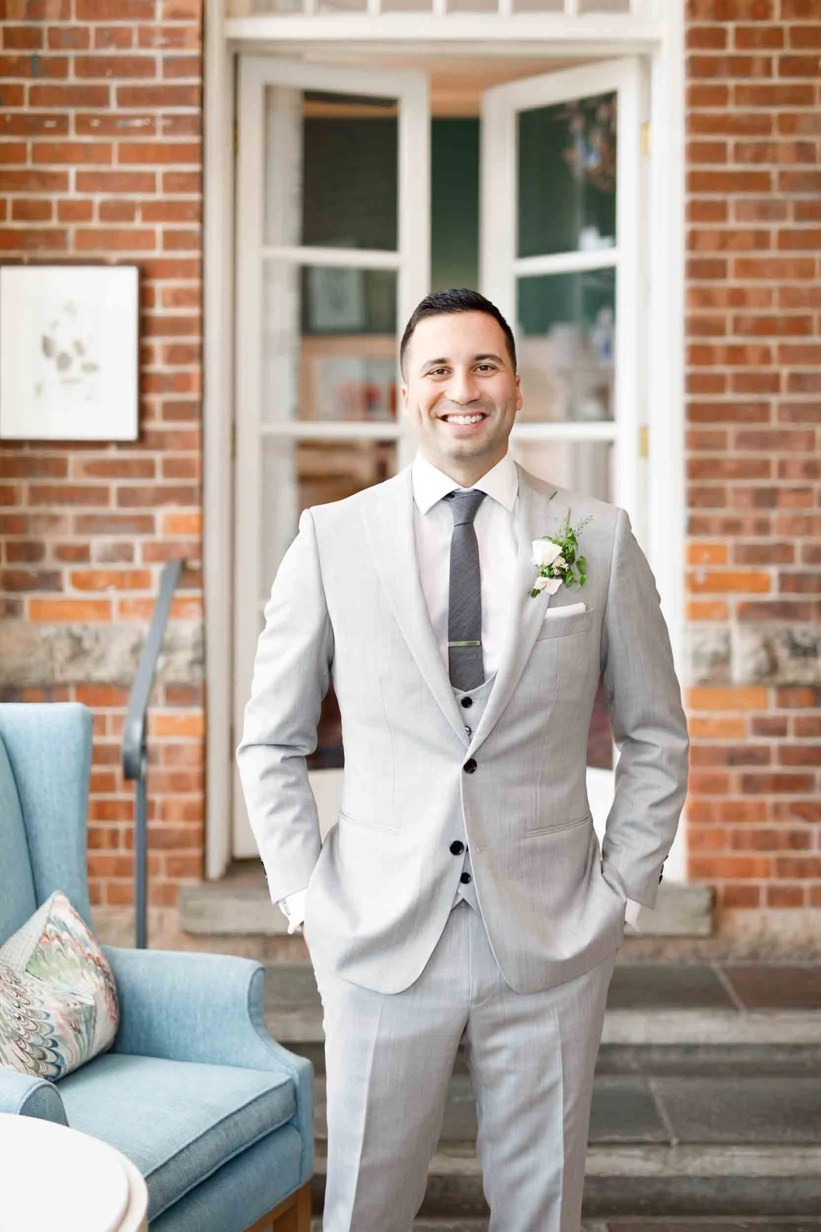 Groom standing inside Langdon Hall Country House Hotel before elegant wedding portraits in Cambridge, Ontario (Copy)