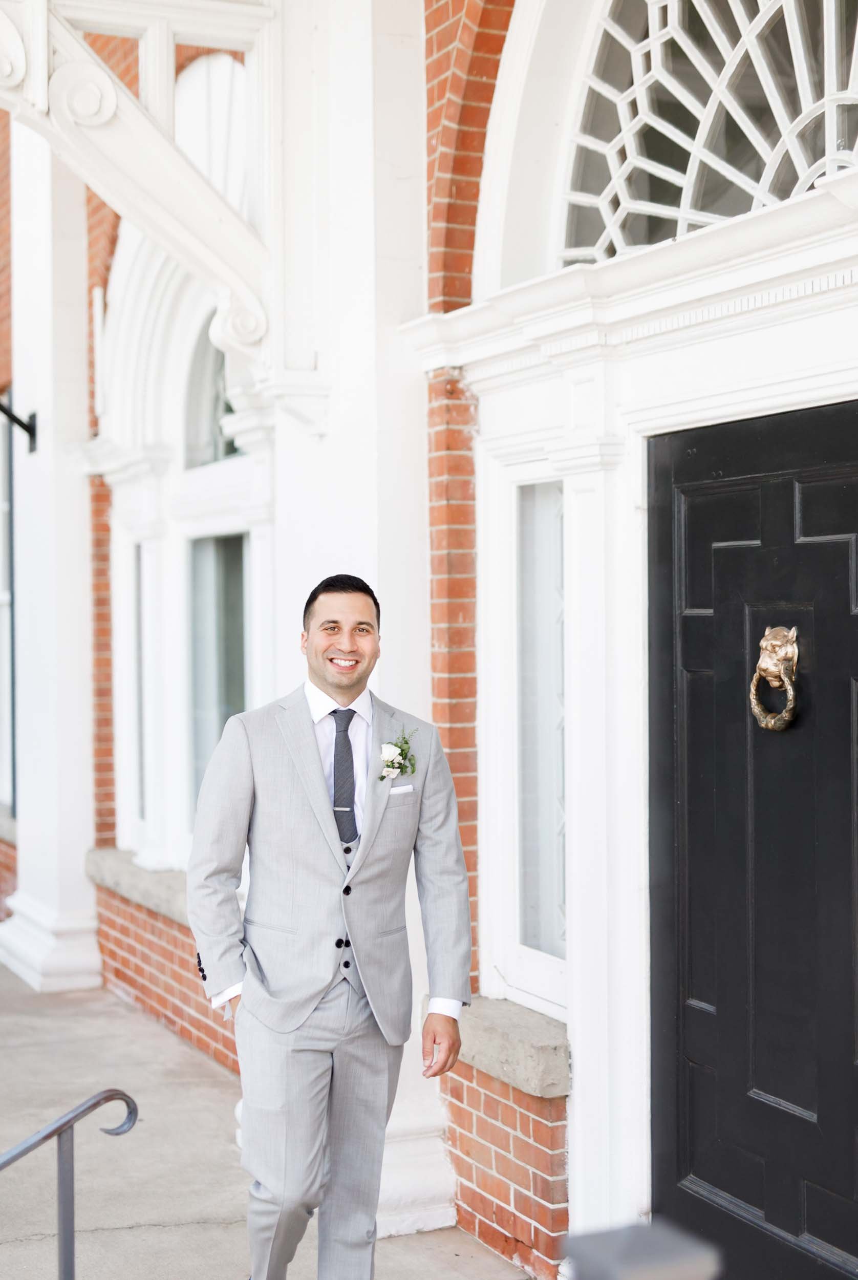 Groom portrait outside the historic entrance of Langdon Hall Country House Hotel in Cambridge (Copy)