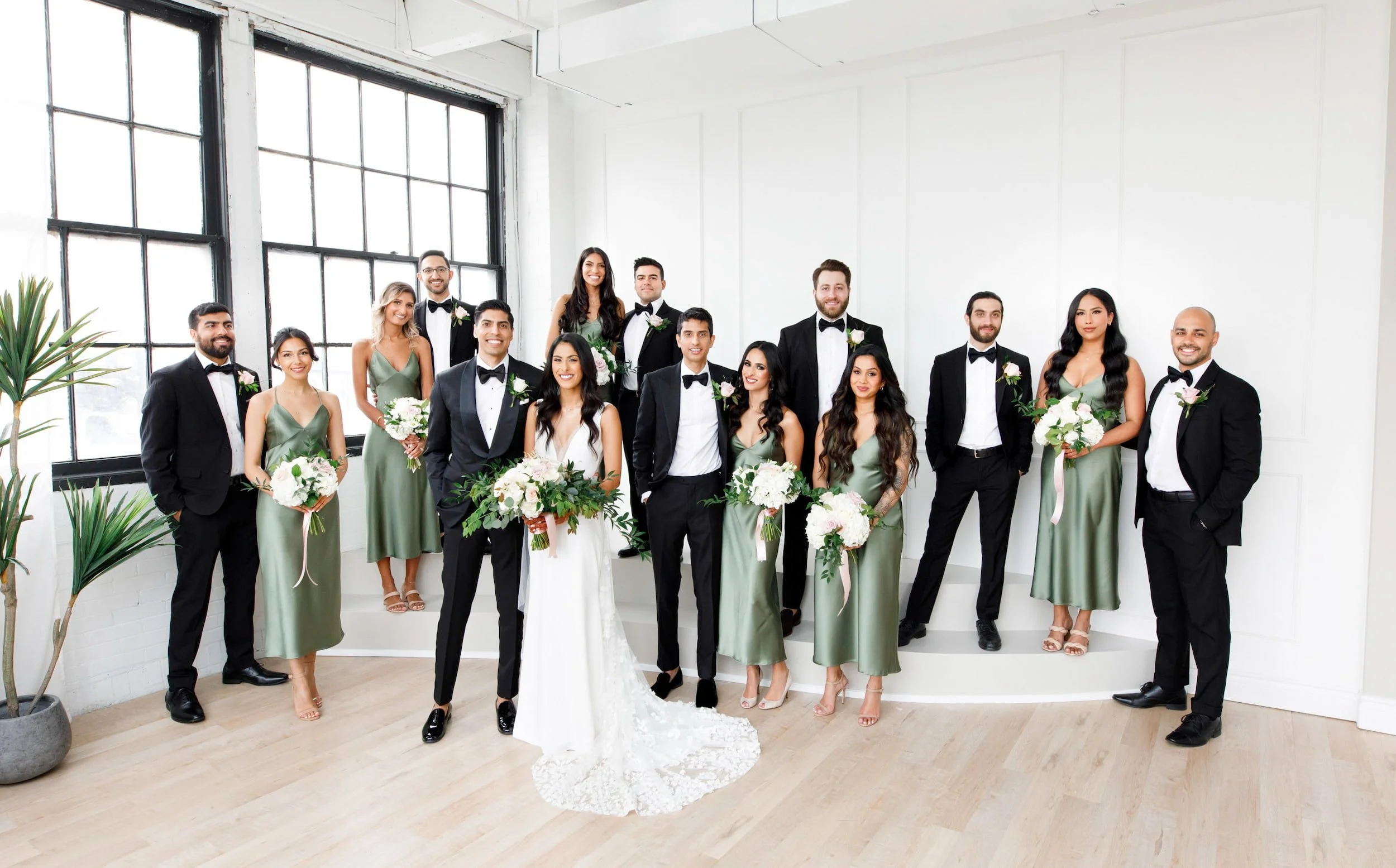 Full wedding party posed inside Park Hill Studios during a modern studio wedding portrait session in Cambridge, Ontario (Copy)