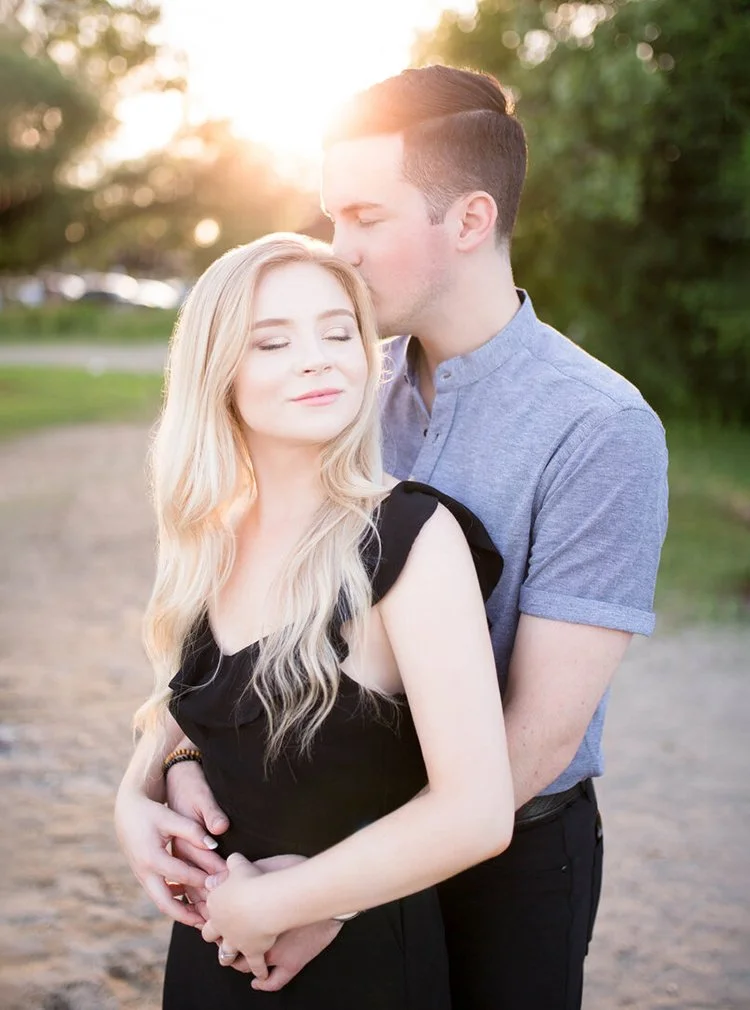 Engagement photo of a couple at Cherry Beach in Toronto, Ontario at sunset
