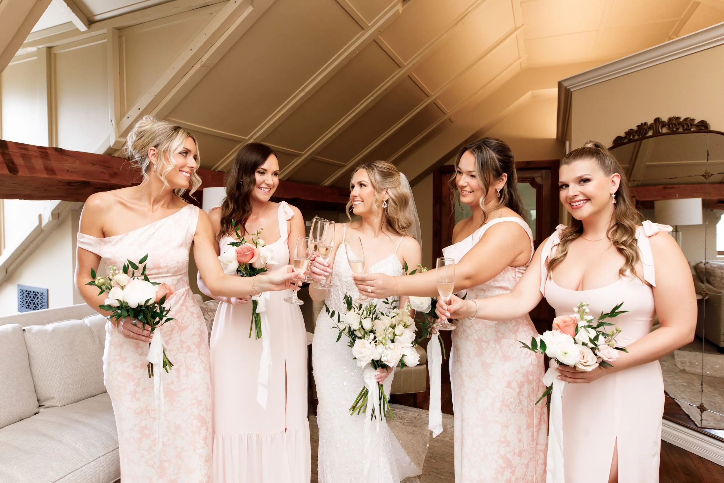 Bridesmaids celebrating during bridal prep at the Ancaster Mill