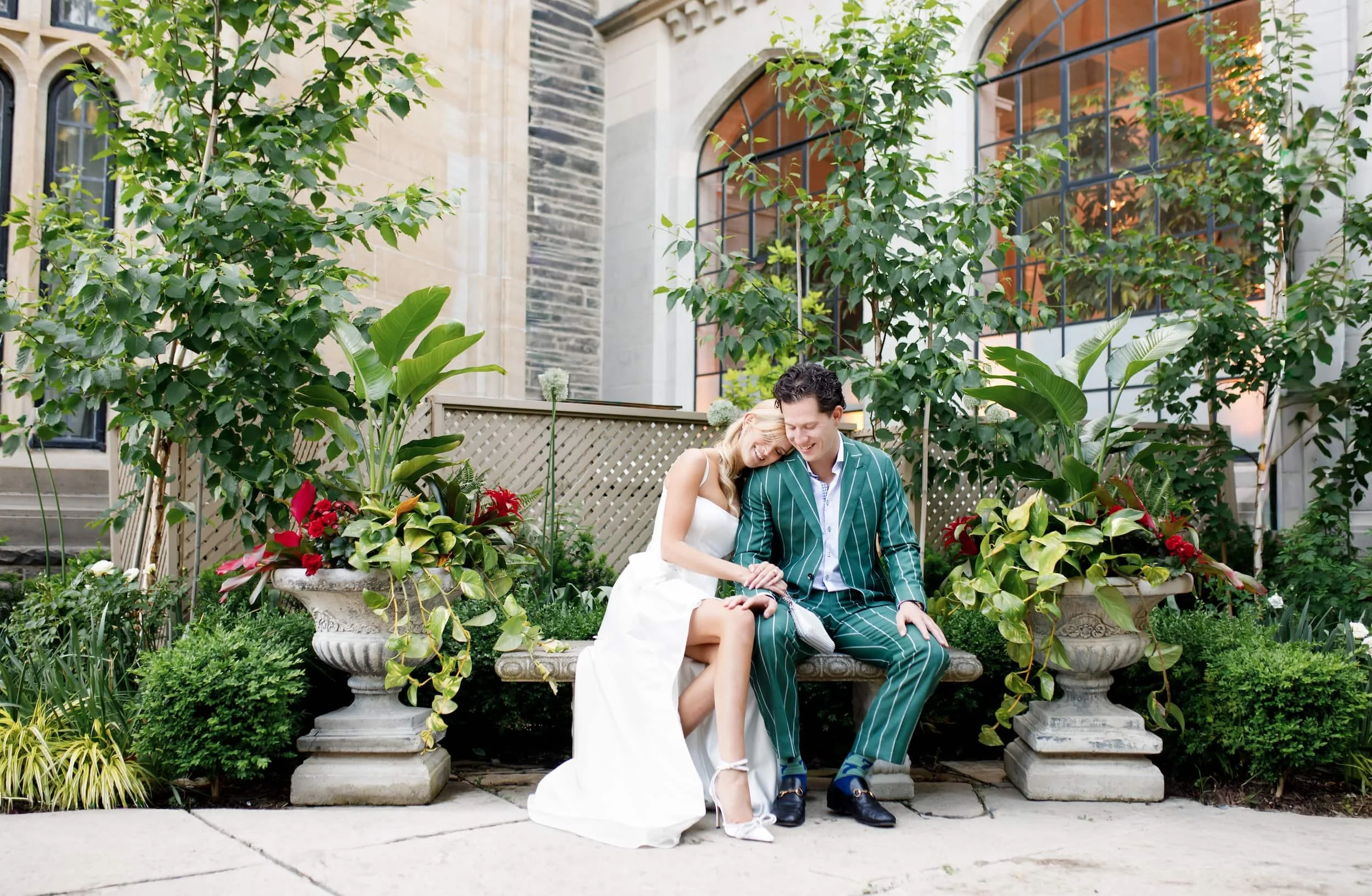 Couple seated in Casa Loma courtyard garden