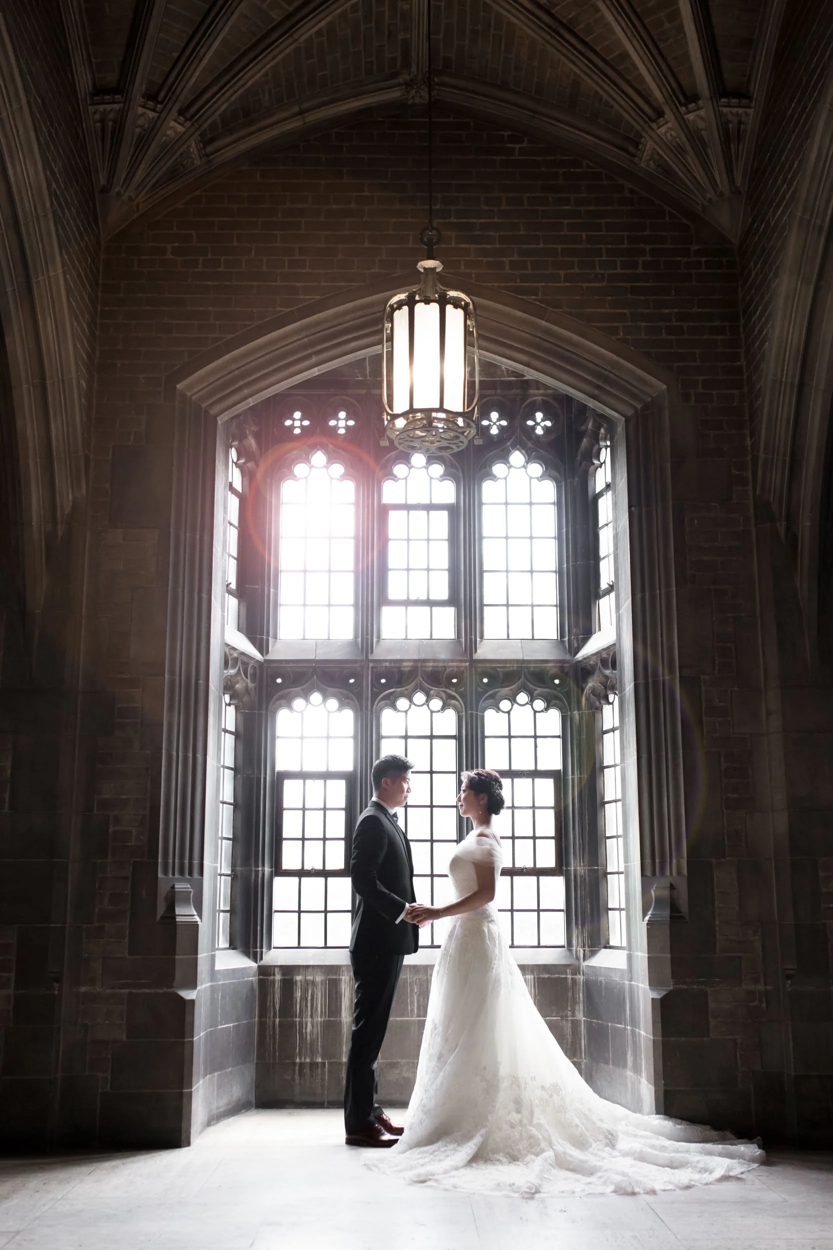 Romantic silhouette beneath vaulted ceiling at Knox College, University of Toronto in Toronto, Ontario