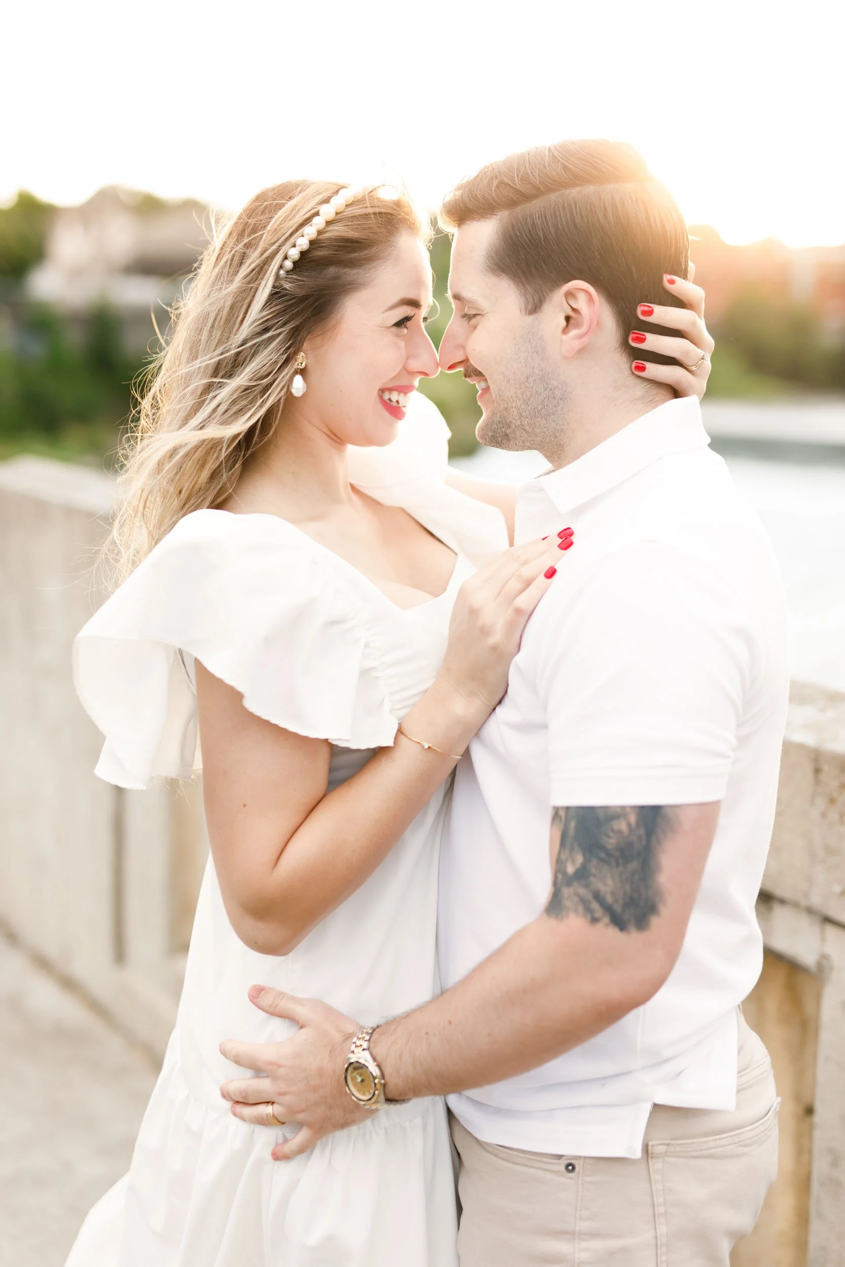 Golden hour engagement portrait at Mill Race Park overlooking the Grand River in Cambridge, Ontario