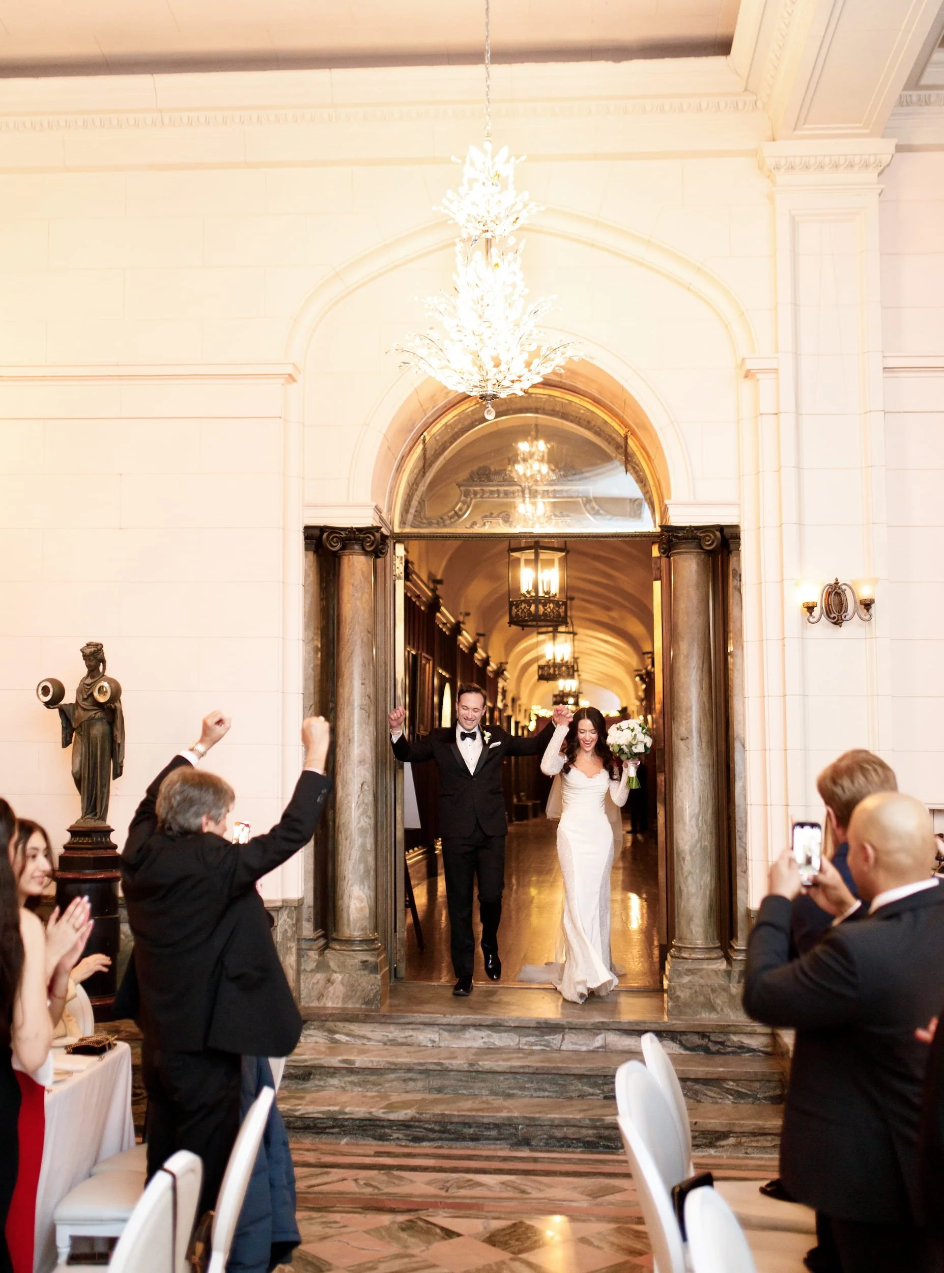 Grand wedding entrance through Casa Loma marble hallway