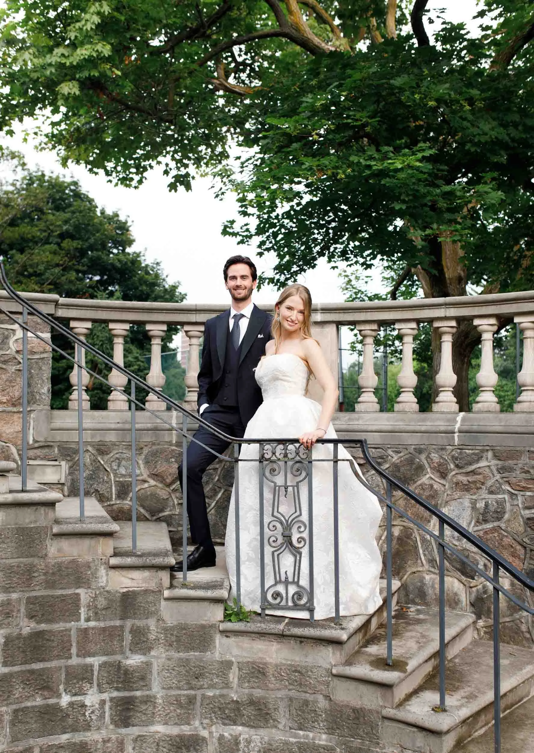 Bride and groom portrait on terrace at Graydon Hall Manor in Toronto