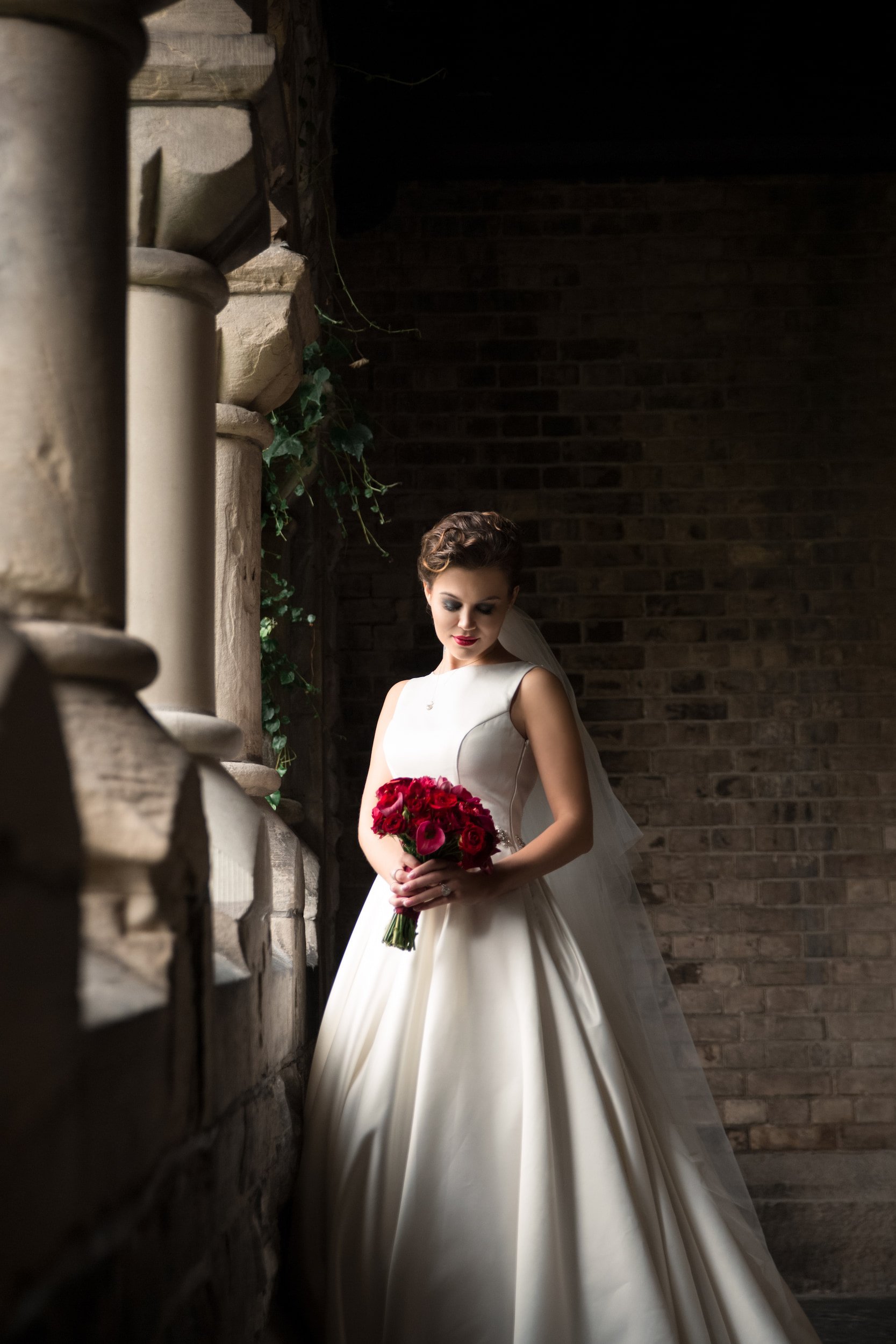 Bridal portrait in dramatic window light at Knox College, University of Toronto in Toronto, Ontario