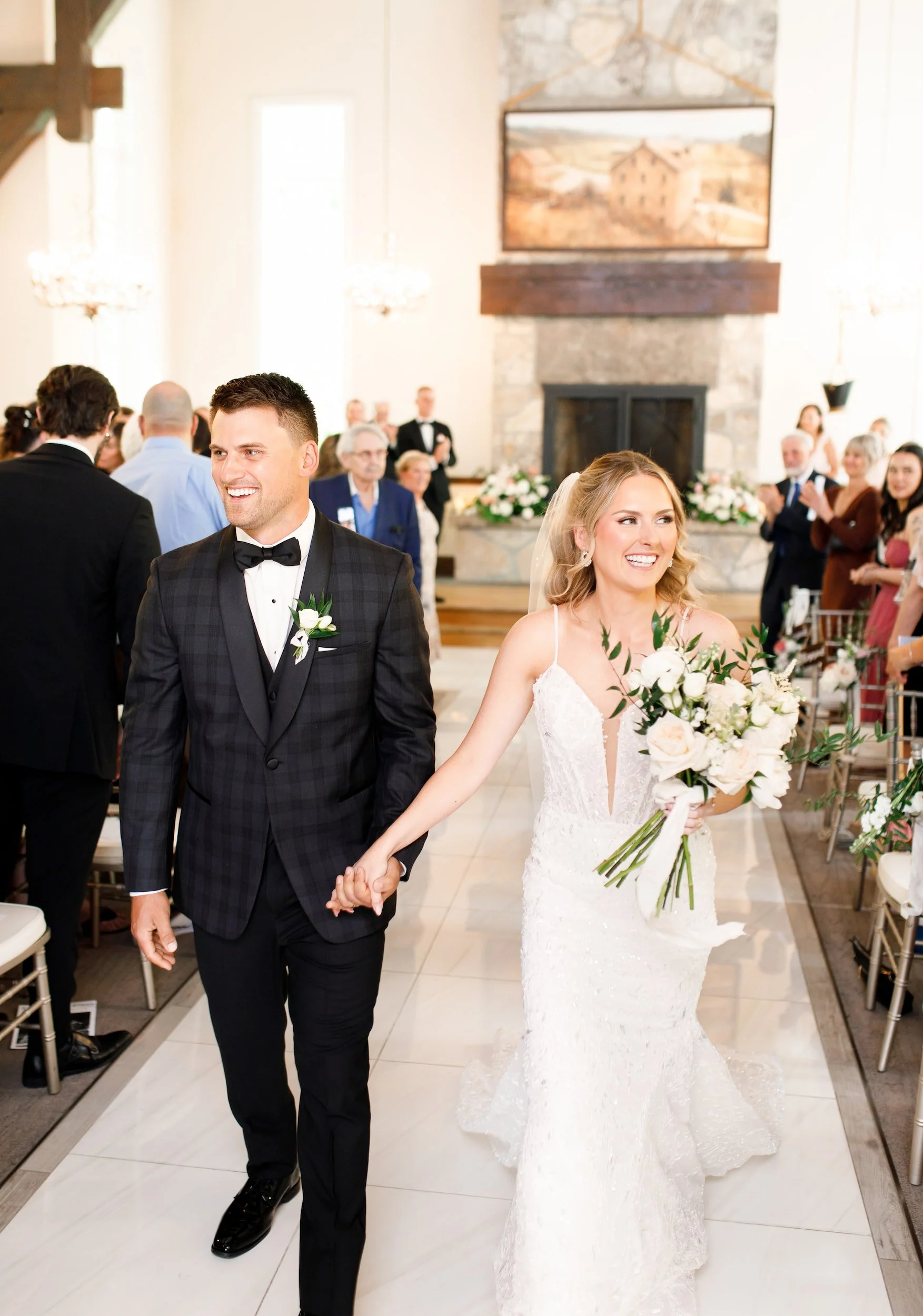 Bride and groom recessional inside Miller’s Chapel at the Ancaster Mill