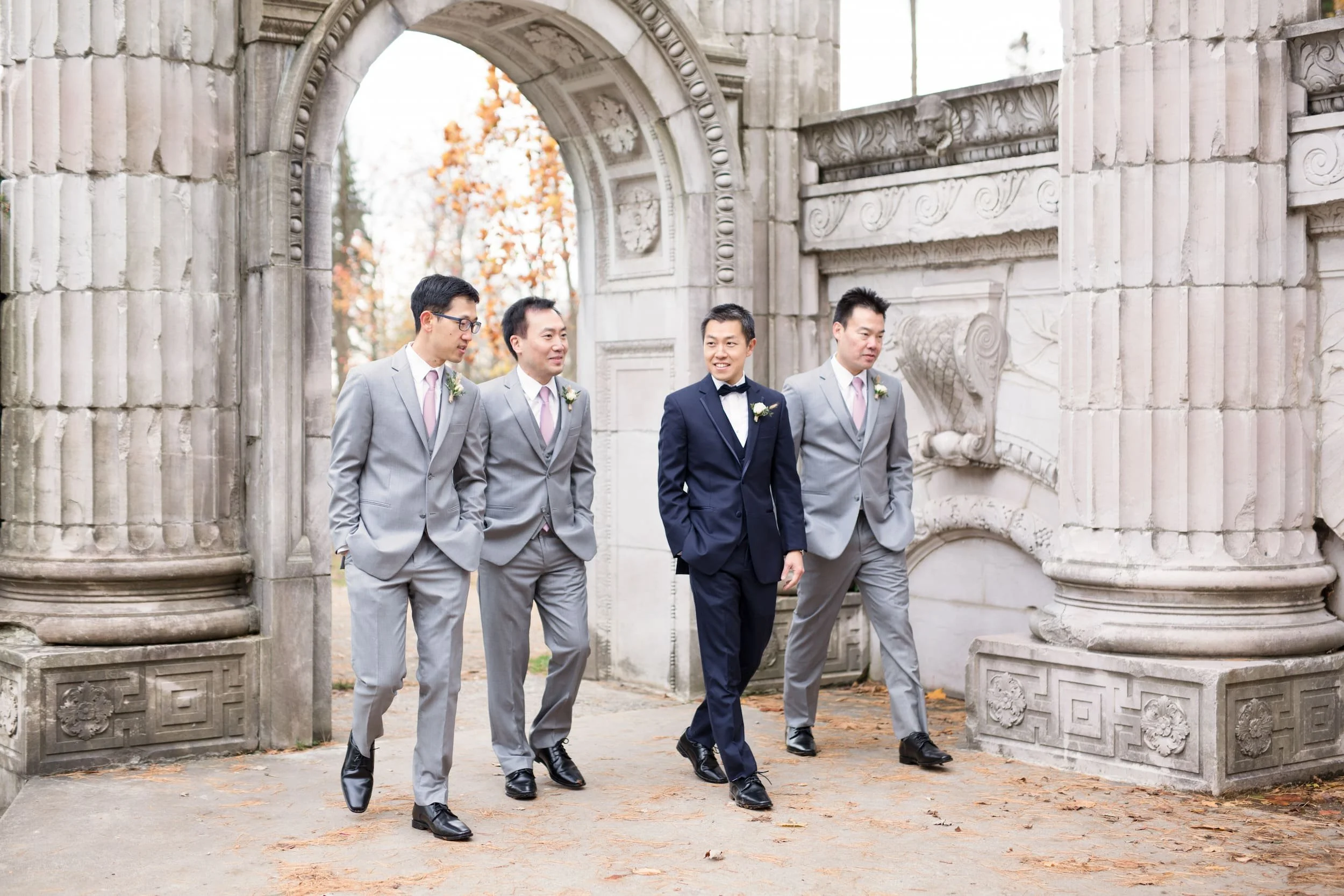 Groomsmen walking through Guild Inn Estate gardens in Scarborough