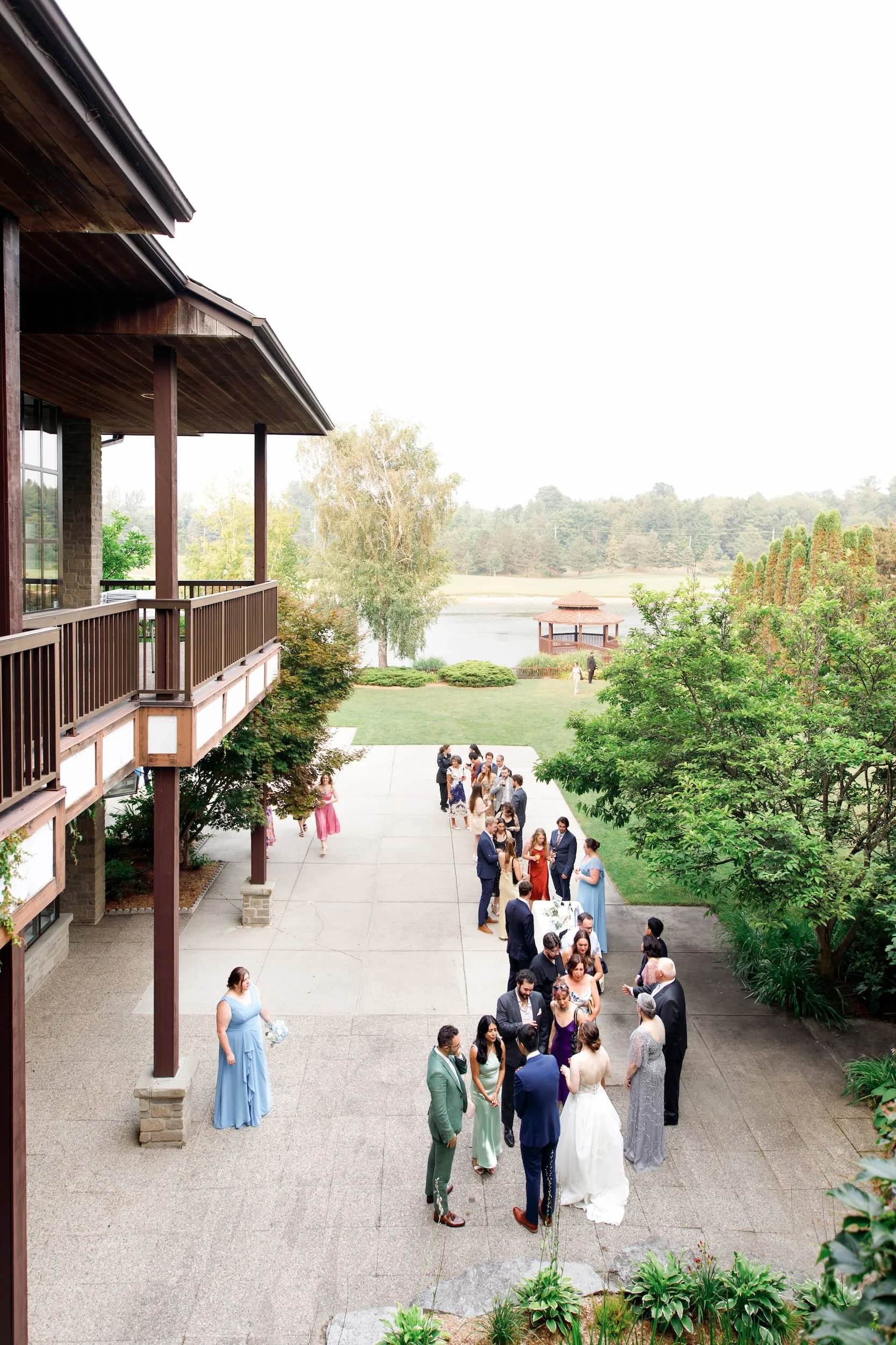 Overhead aerial view of guests gathered outside The Manor Event Venue in King, Ontario