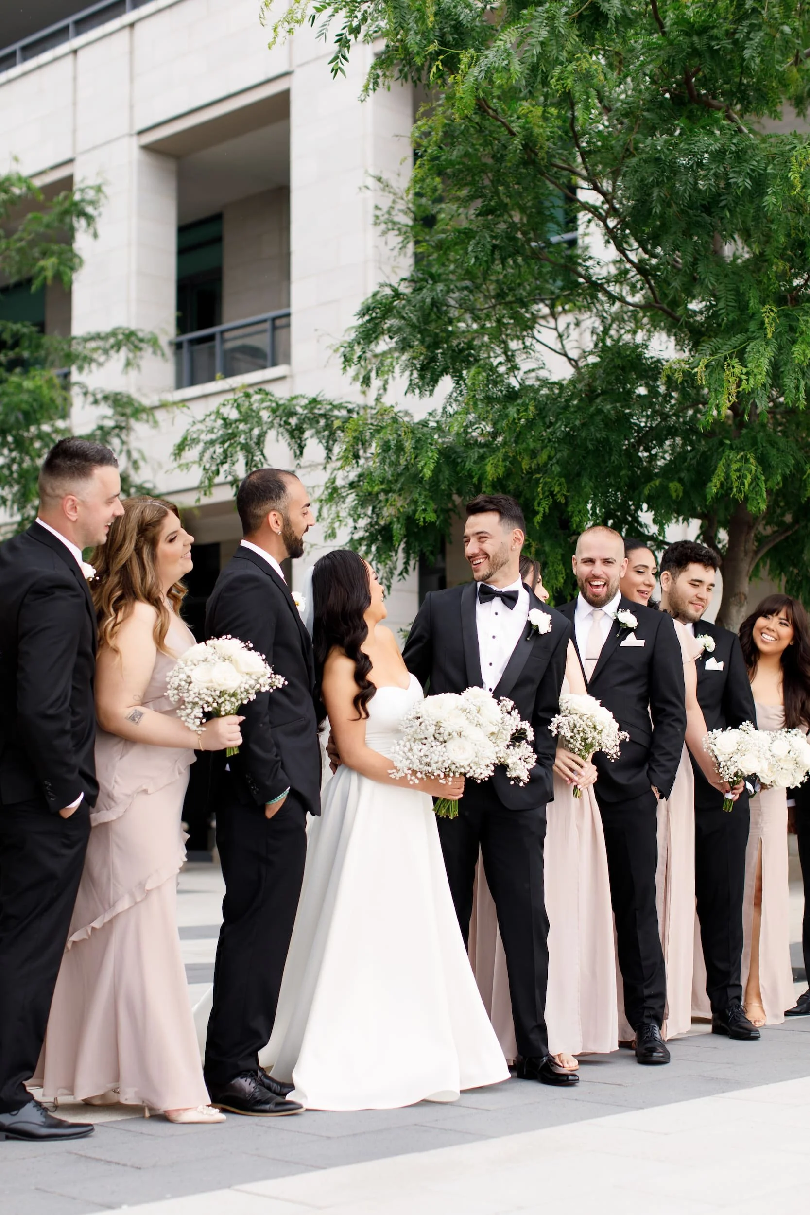 Bridal party candid moment near The Pearle Hotel in Burlington, Ontario